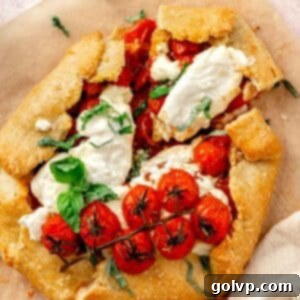 tomato galette sliced with fresh basil and mozzarella