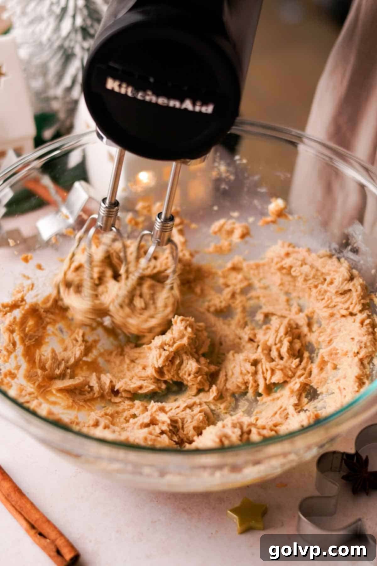 Beating softened butter and brown sugar until light and creamy in a mixing bowl
