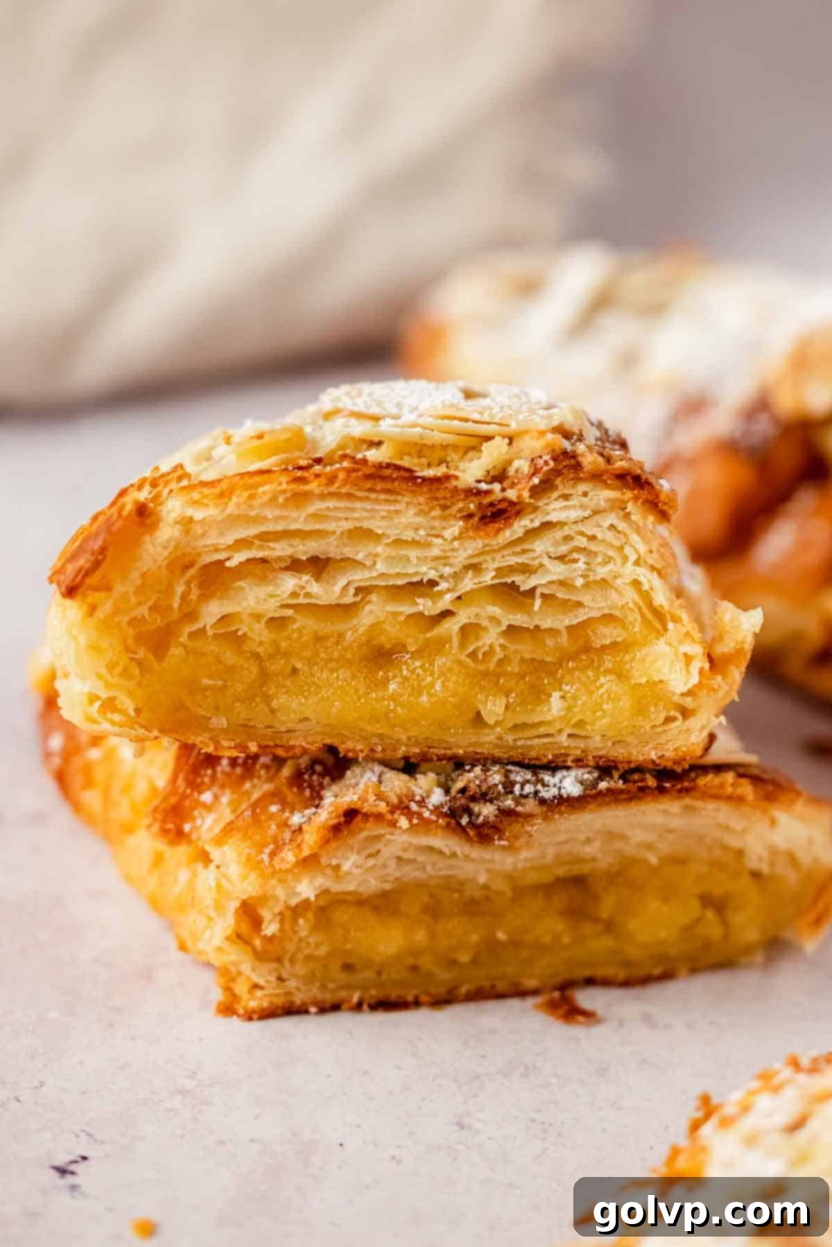 almond croissant cut in half with frangipane filling