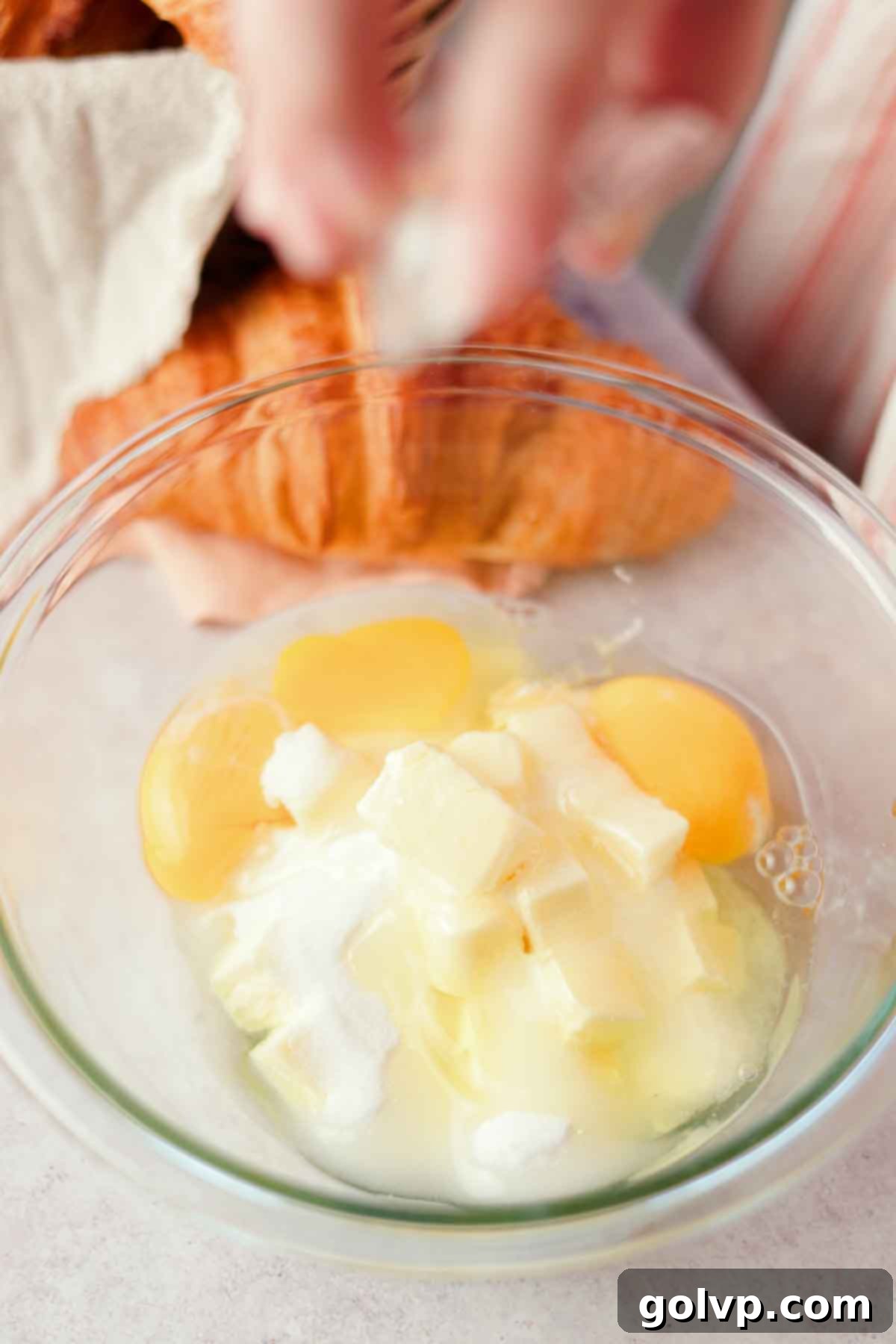 combining sugar, butter, and eggs