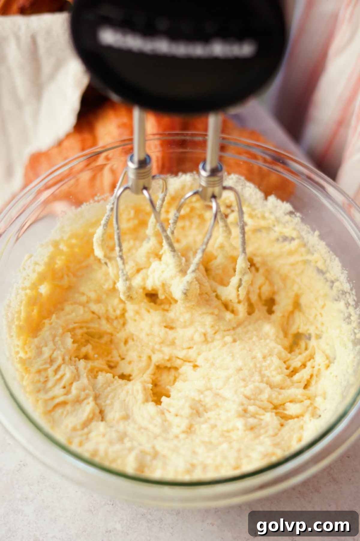 blending frangipane filling with handheld electric mixer