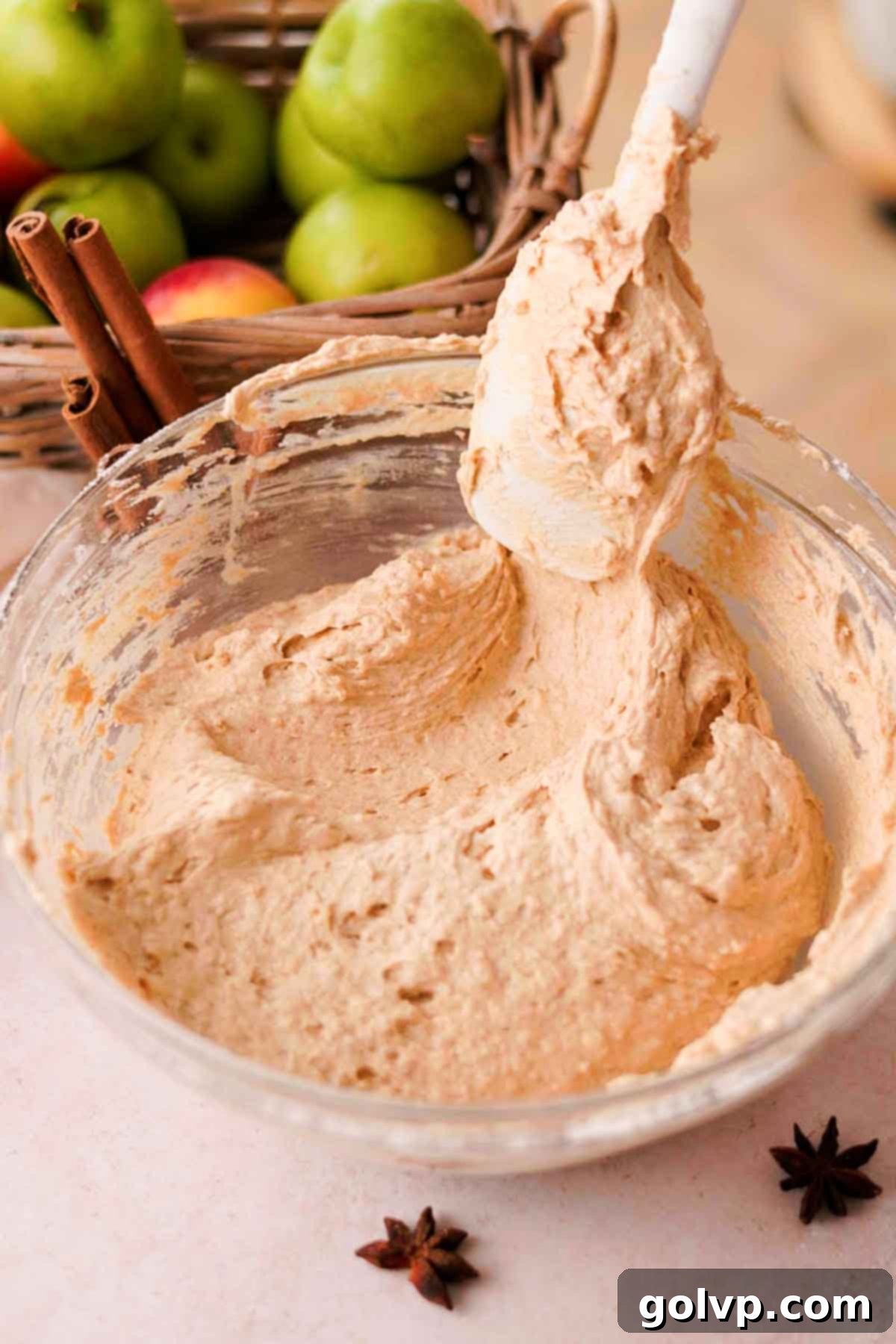 folding thick chai cake batter with a rubber spatula