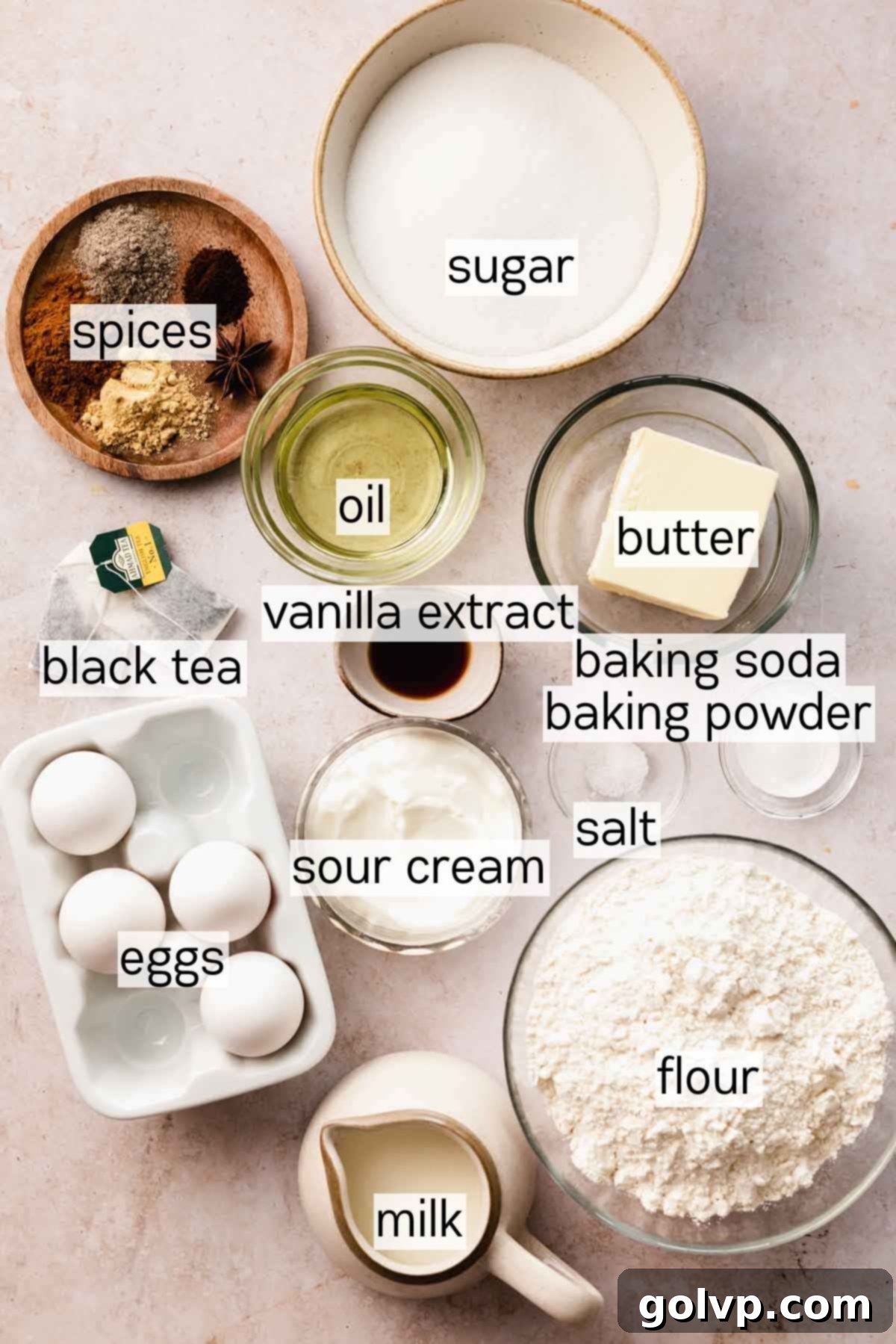 ingredients for chai cake in small bowls