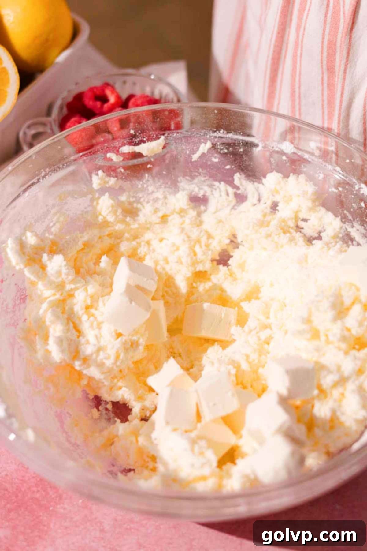 adding cubed cream cheese to frosting