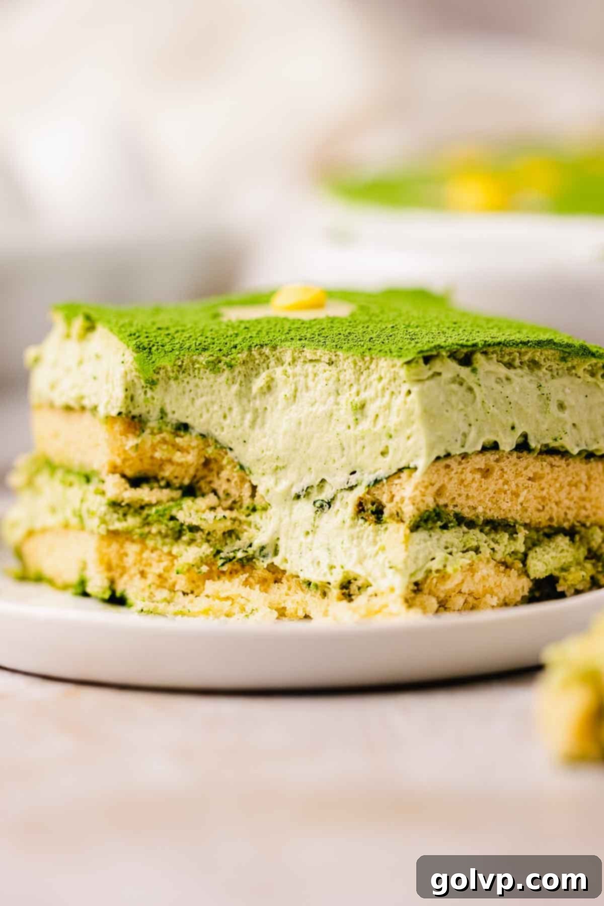 closeup of the smooth, creamy texture of matcha tiramisu in a dish