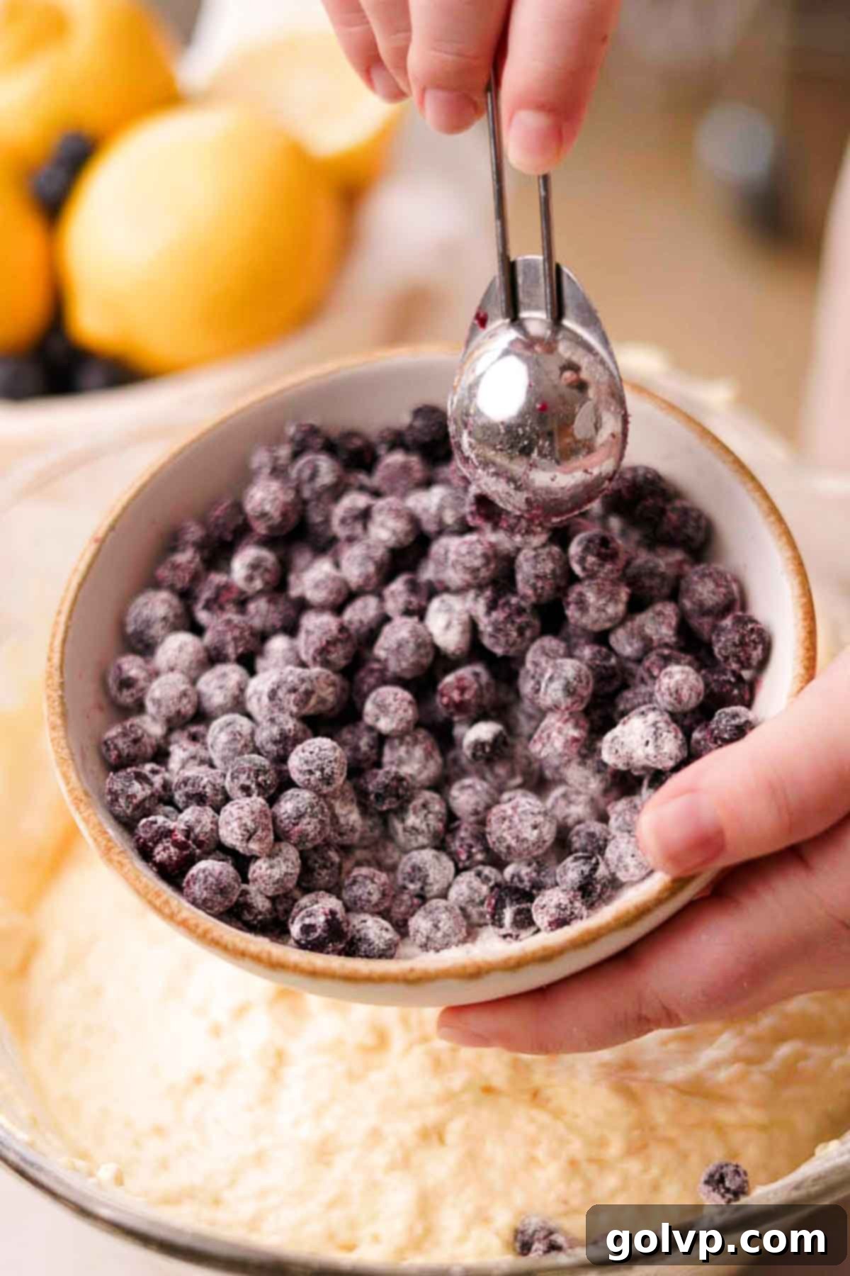 Tossing frozen wild blueberries with a tablespoon of all-purpose flour in a separate bowl to prevent sinking.
