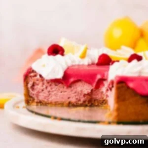 lemon raspberry cheesecake with raspberry curd topping sliced
