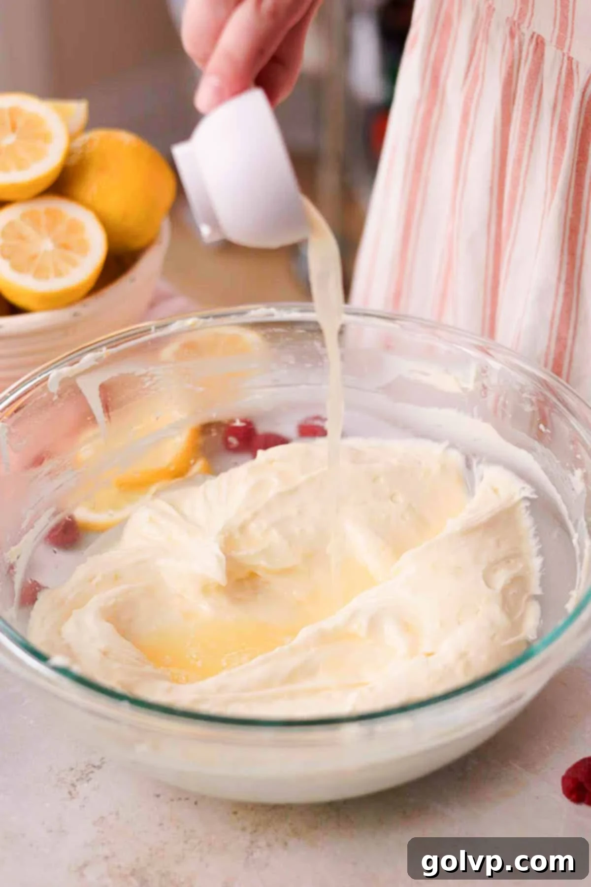 pour lemon juice into cheesecake batter
