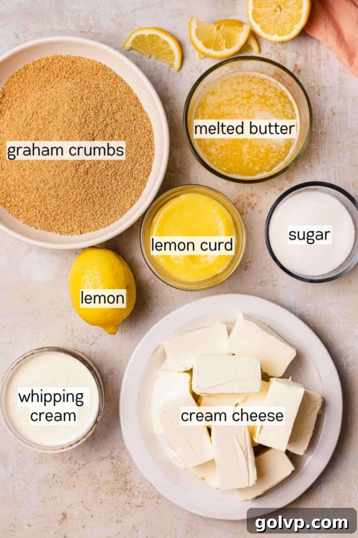Selection of key ingredients for lemon curd cheesecake
