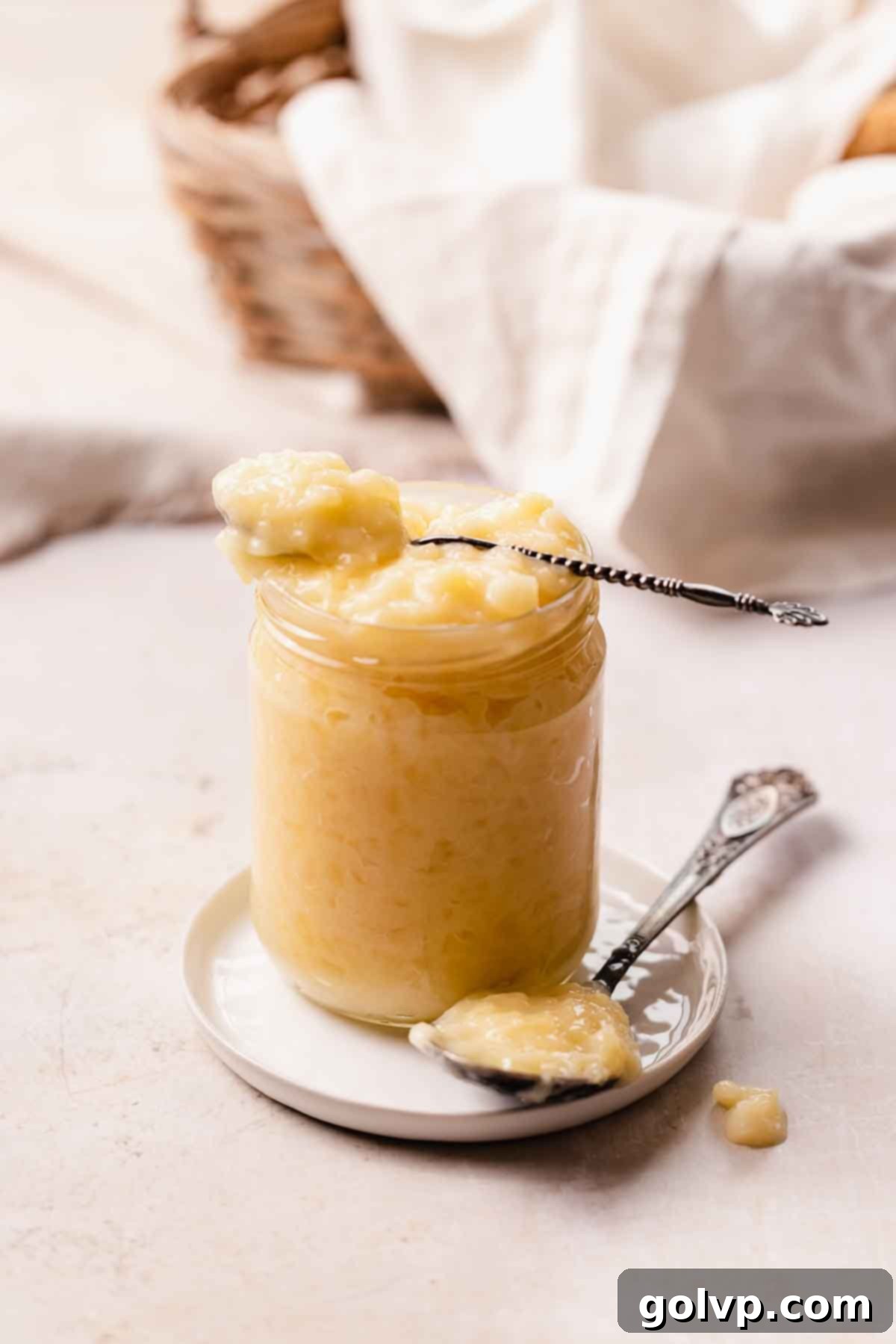 a jar and a few spoons filled with pineapple cake filling