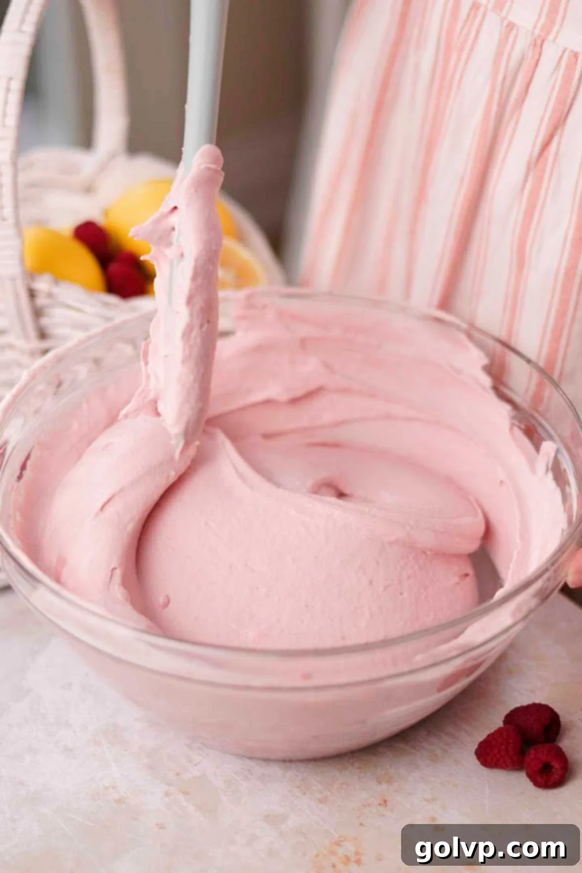 fold whipped cream into raspberry tiramisu filling with a spatula