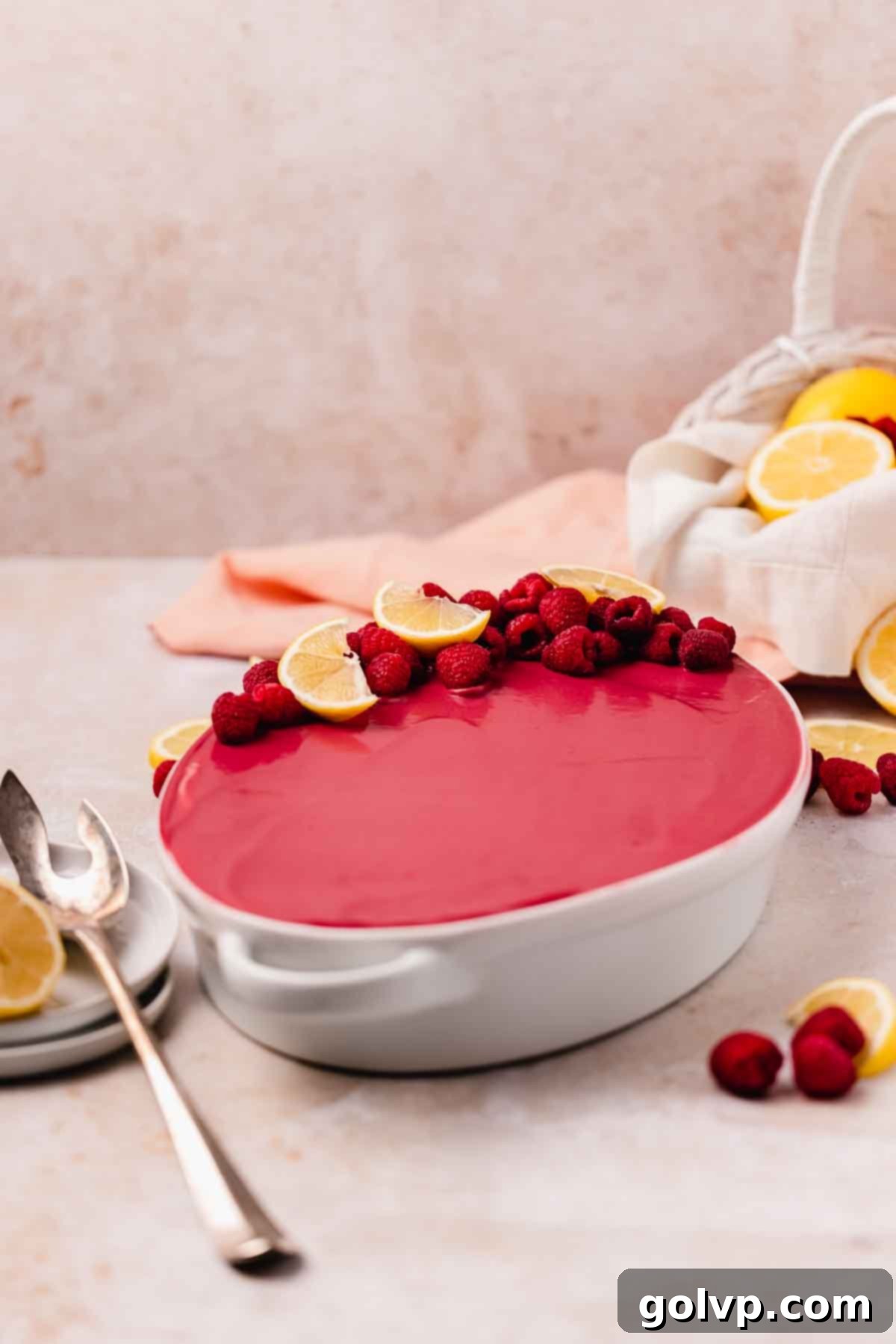 raspberry tiramisu with raspberry curd topping in oval white dish