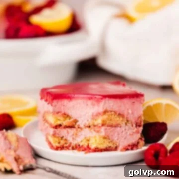 raspberry curd tiramisu slice on small plate with fresh raspberries