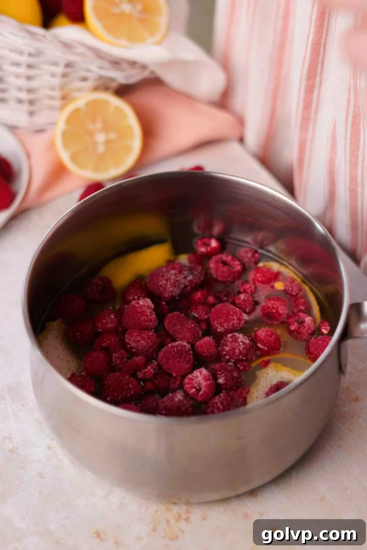 raspberries, lemon, sugar, and water in medium saucepan