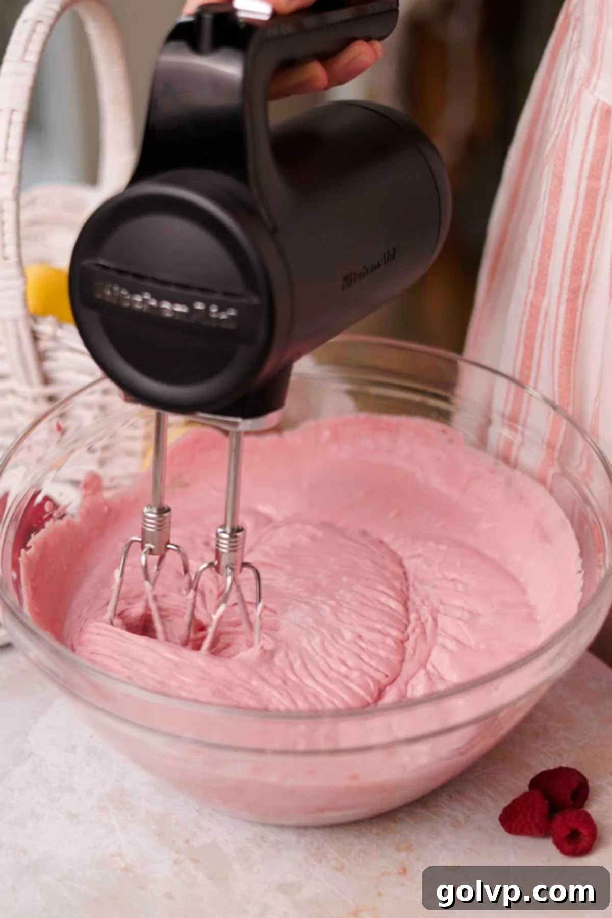 whipping mascarpone and raspberry curd with electric mixer