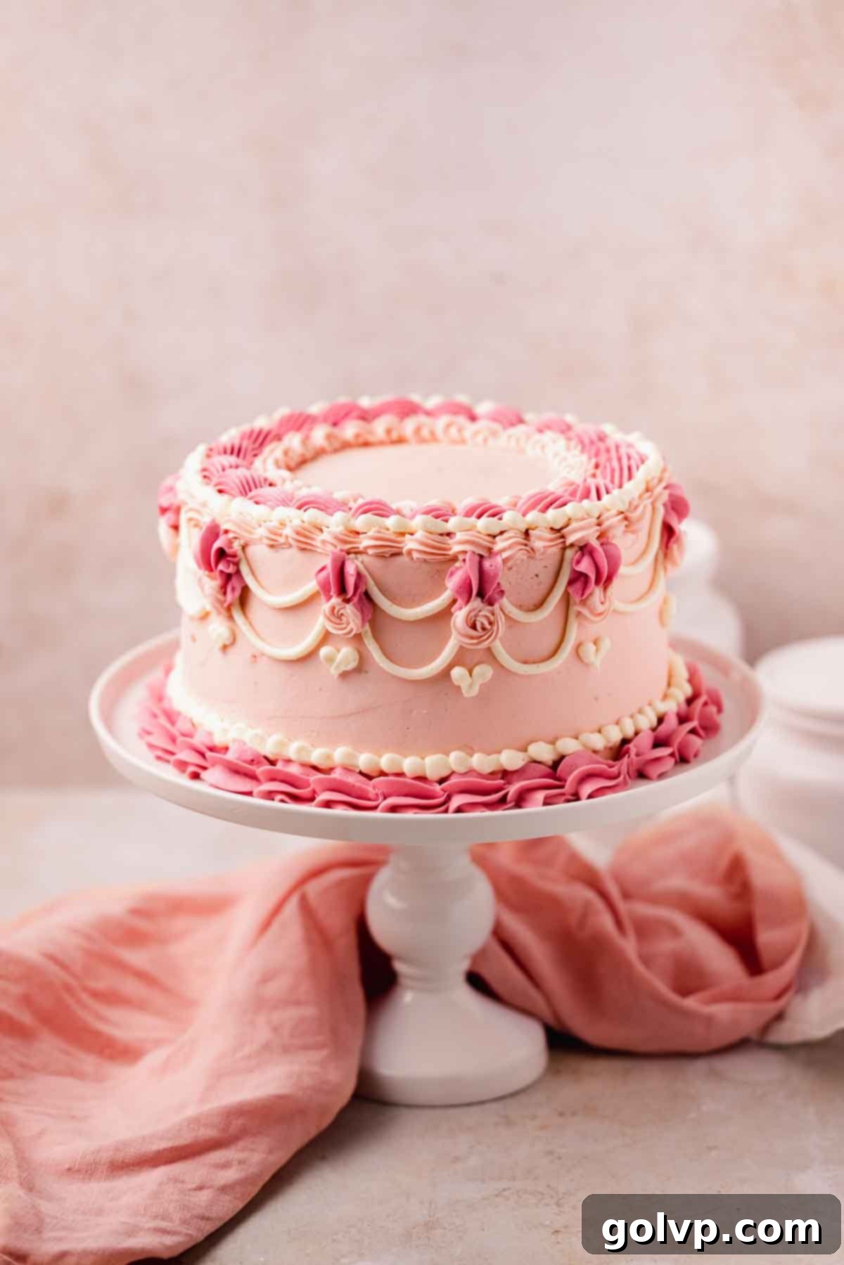 pink velvet cake decorated in vintage style buttercream frosting