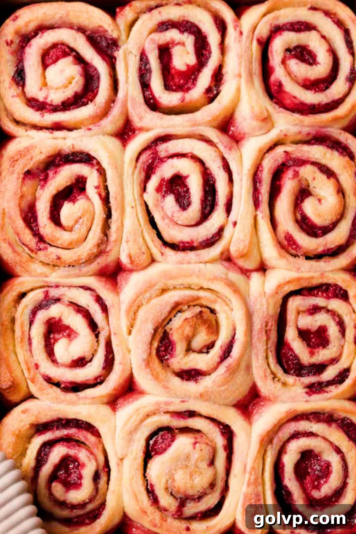 baked raspberry rolls in baking pan