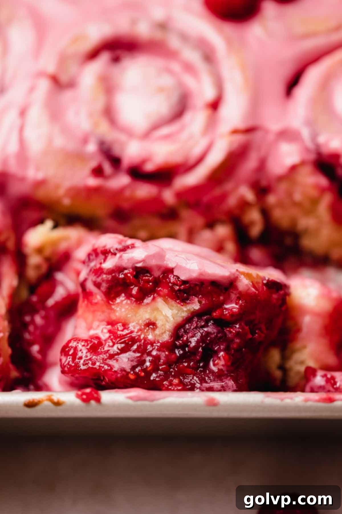 closeup of gooey raspberry sweet roll texture