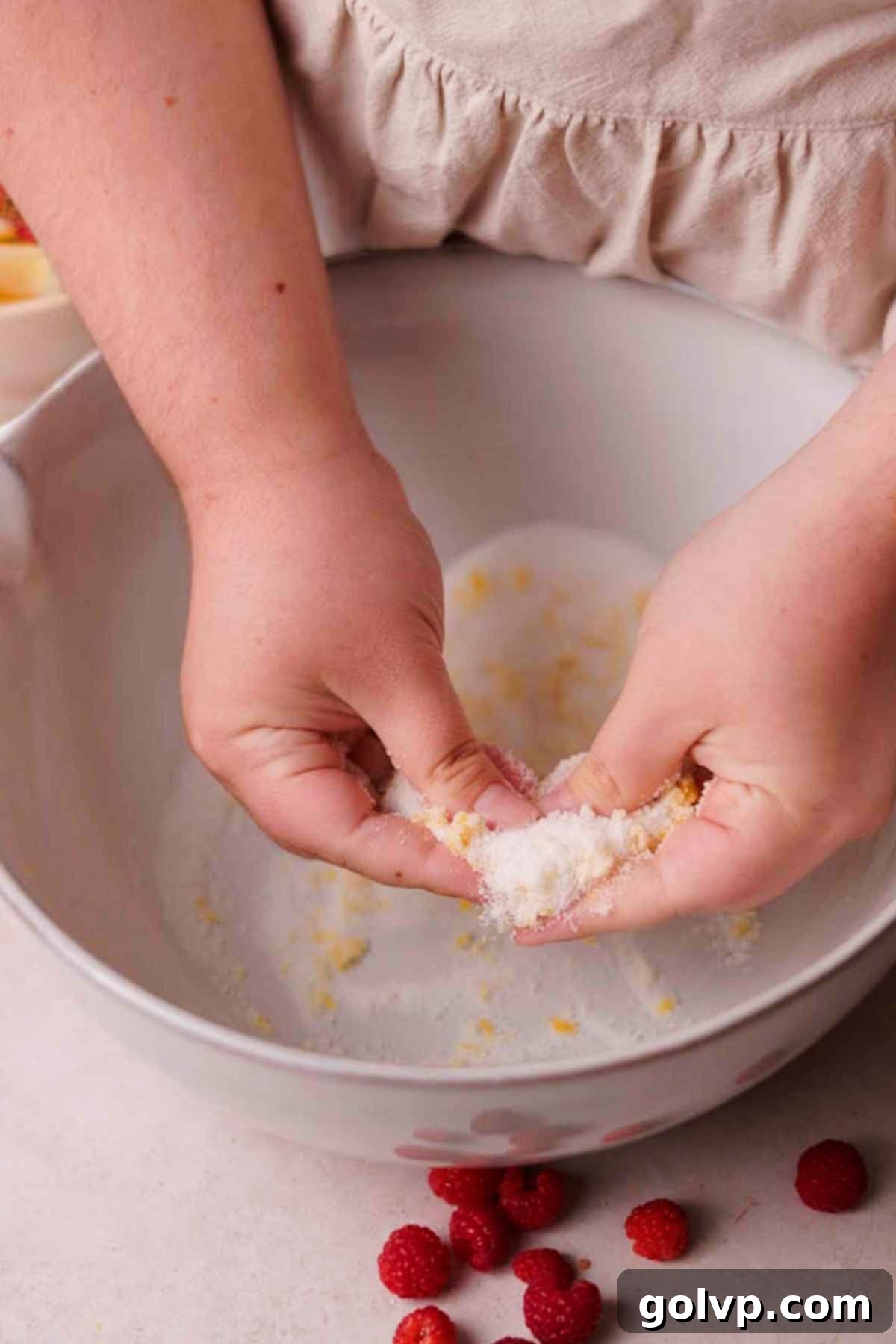 rubbing sugar and lemon zest by hand
