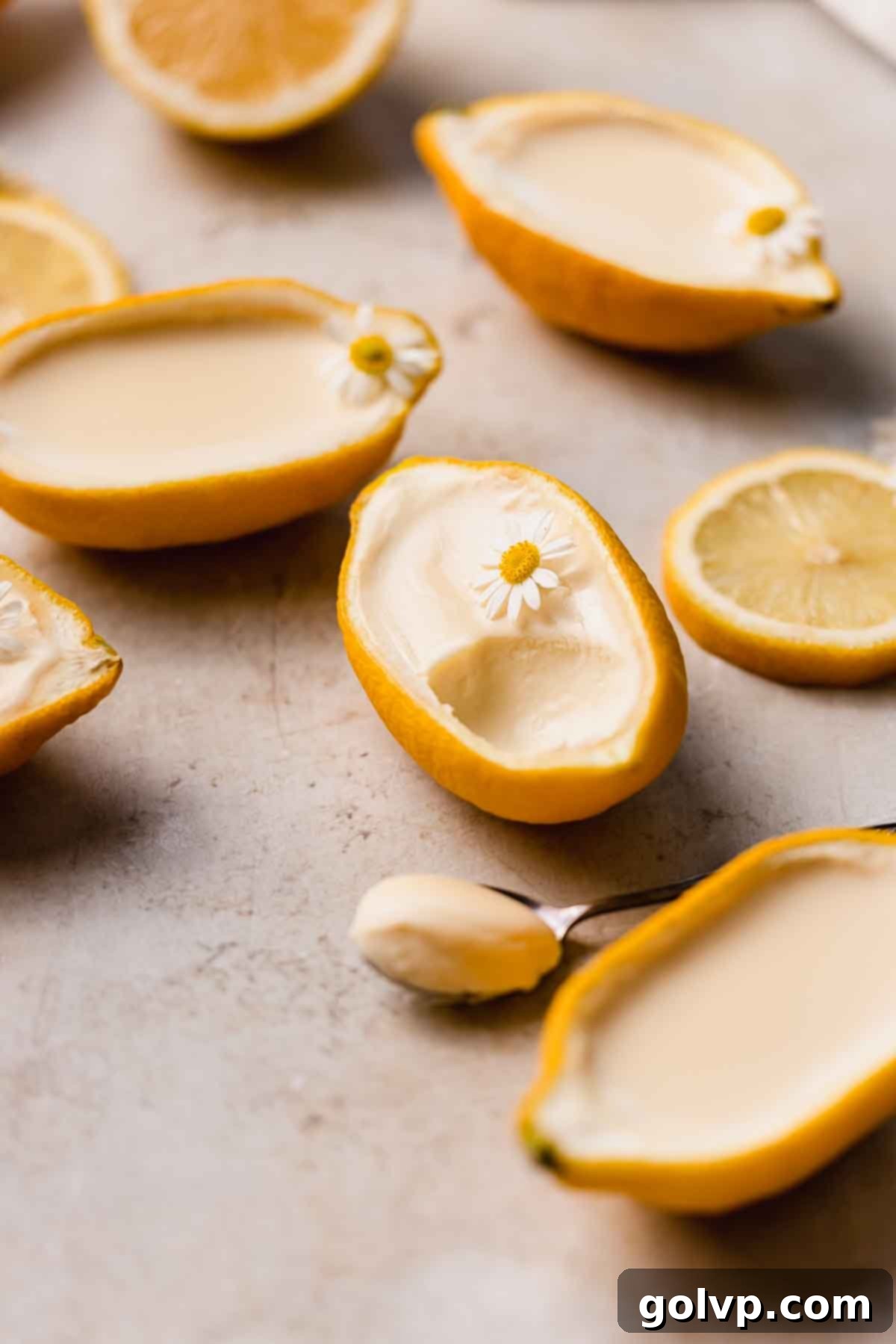 Lemon posset served beautifully in a hollowed-out lemon rind, garnished for an elegant presentation.