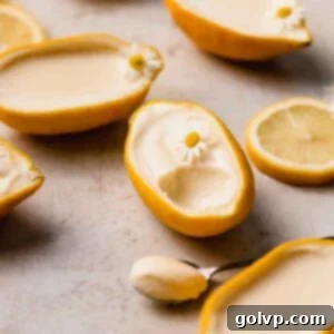 Lemon posset served in its natural lemon rind cup, a perfect, refreshing dessert.