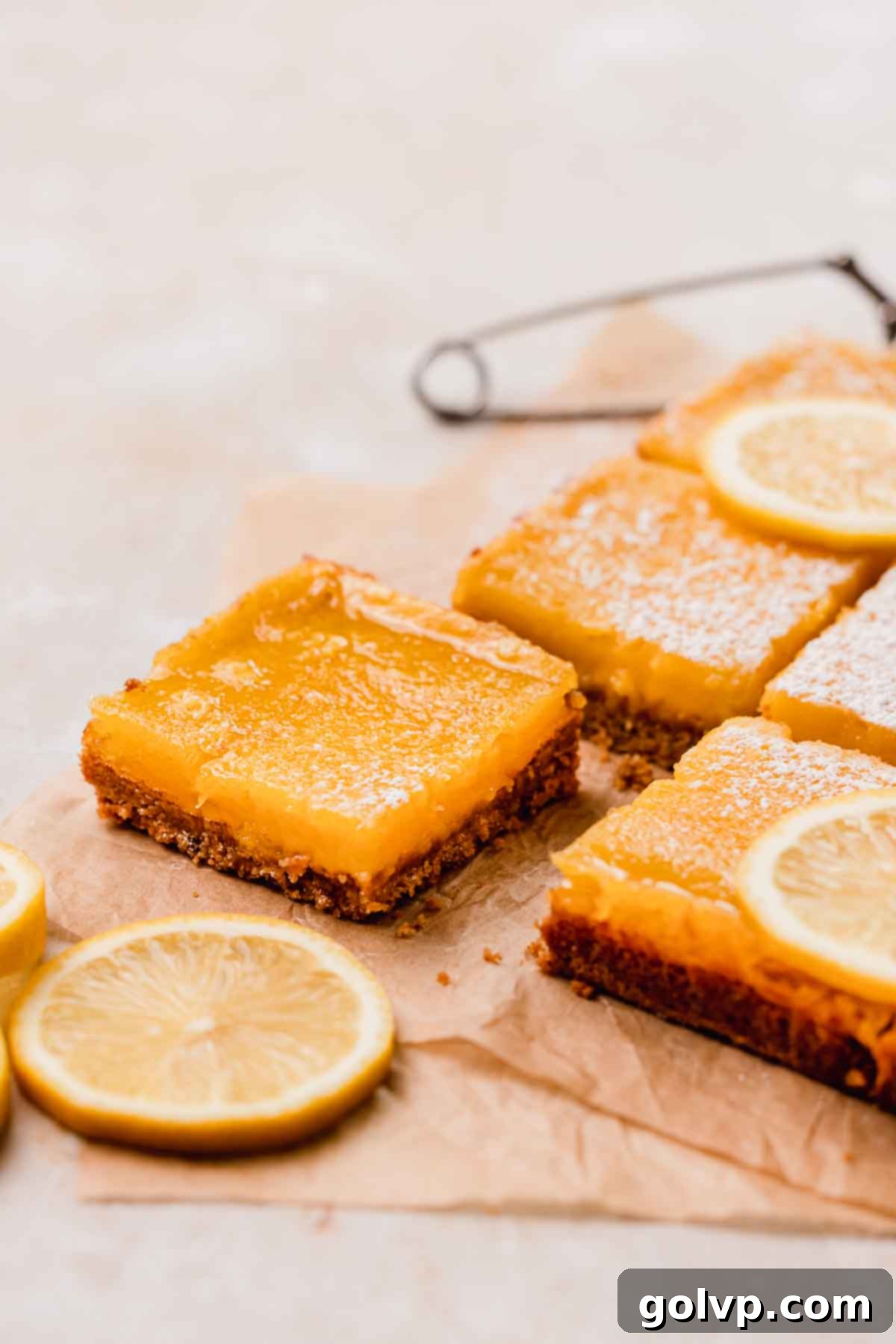 cut lemon bars on parchment paper