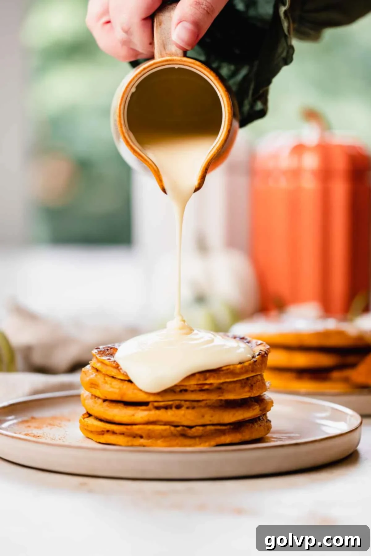 Step 4: Stack of pumpkin spice pancakes drizzled with cream cheese glaze