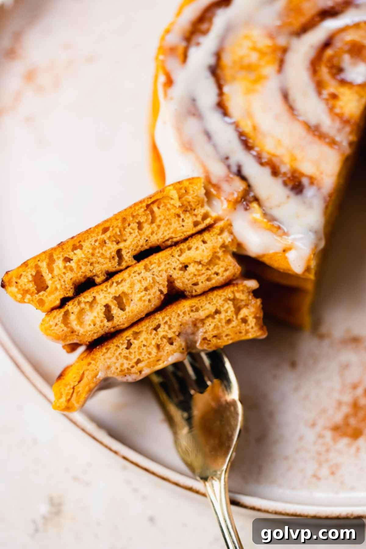 Close-up of fluffy pumpkin spice pancakes stacked with swirl visible
