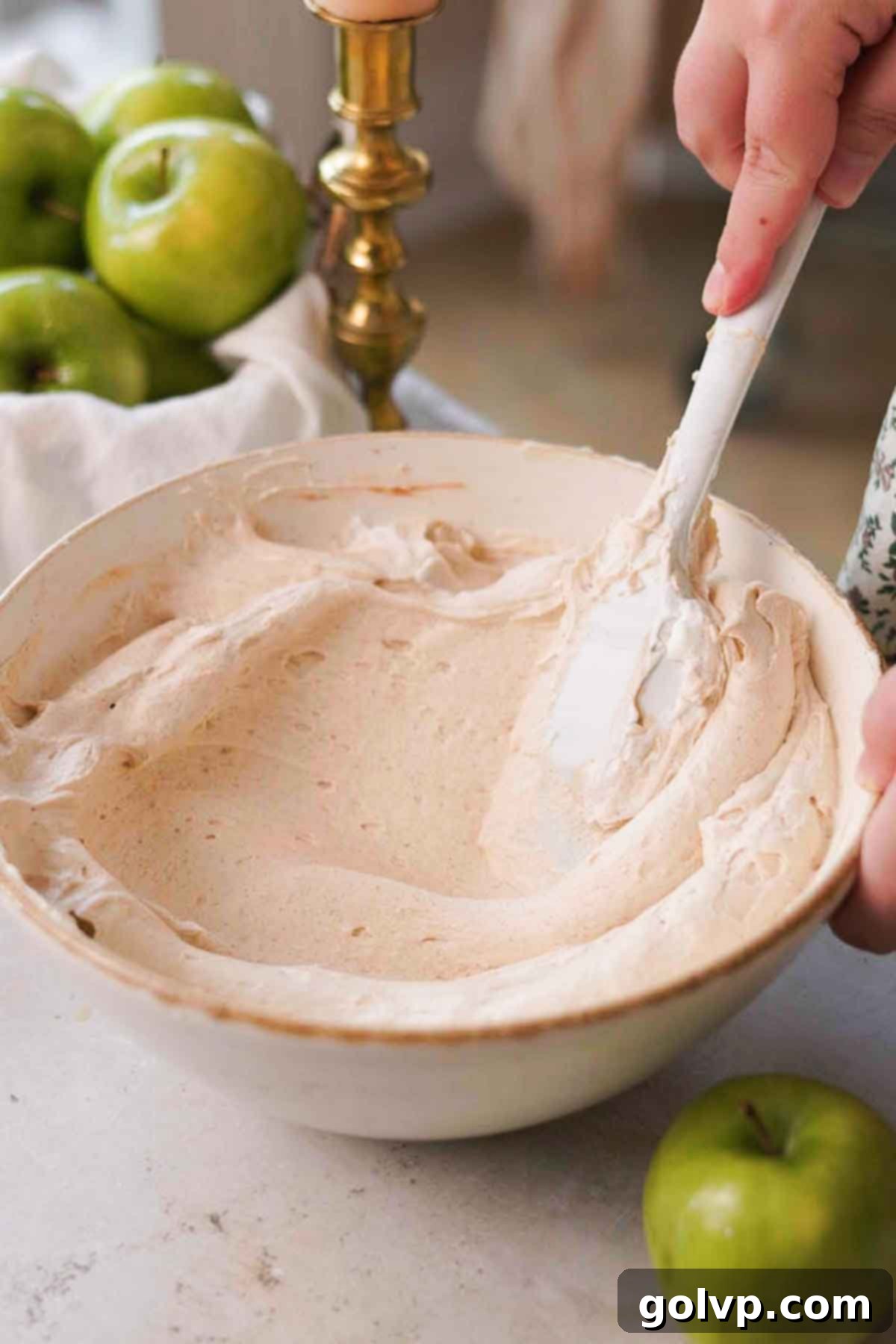 folding apple cheesecake mixture together