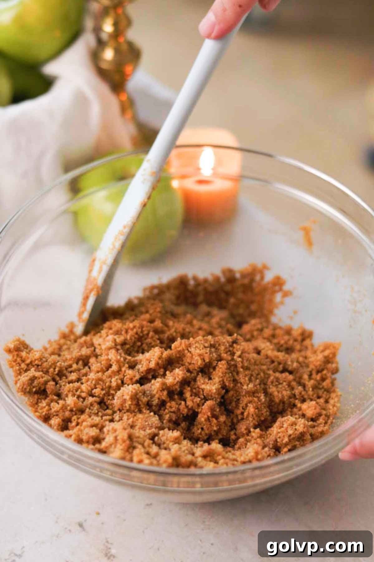 stirring the spiced cheesecake crust
