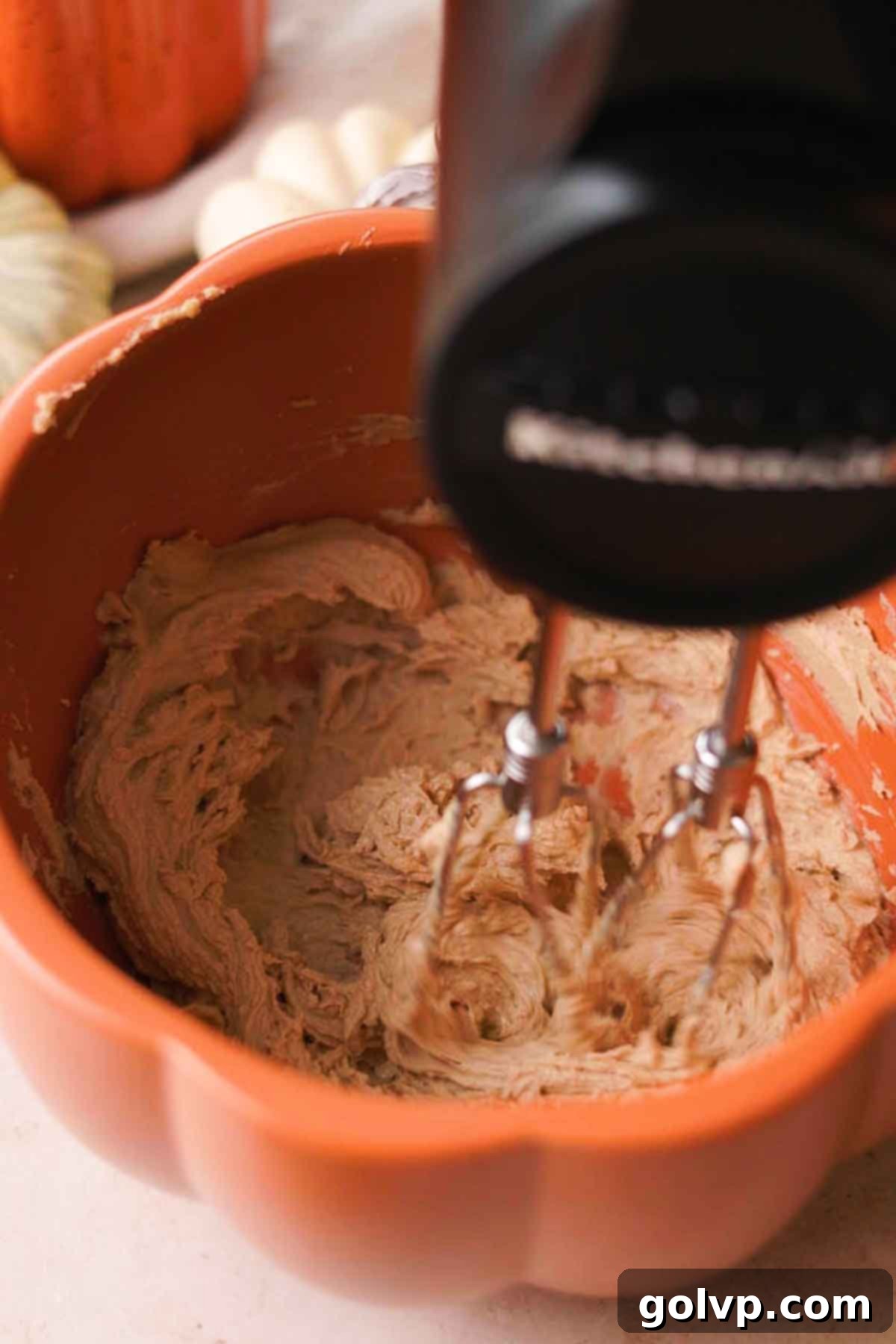Mixing softened butter, granulated sugar, brown sugar, and salt in a large bowl.