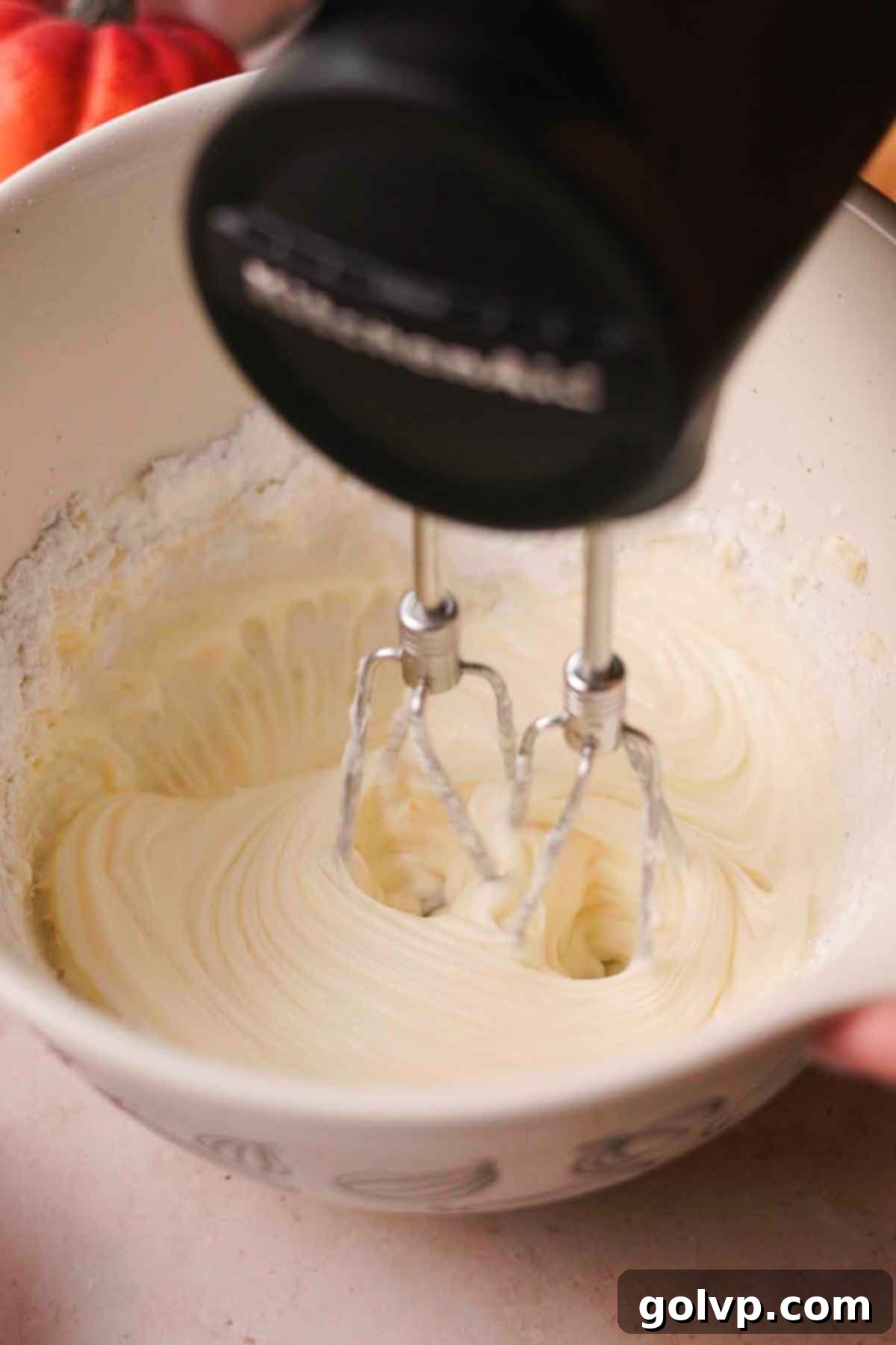 beating cream cheese and powdered sugar together