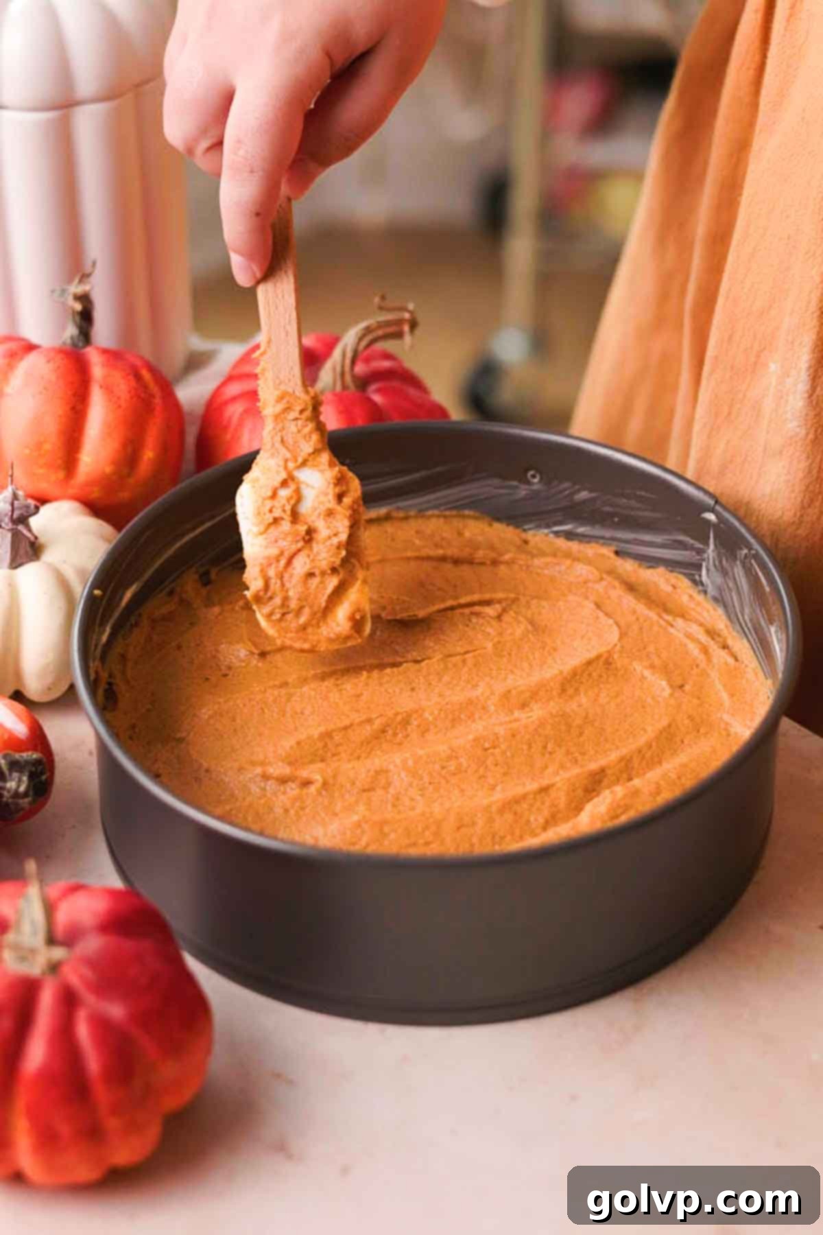 evenly spreading cake batter in pan