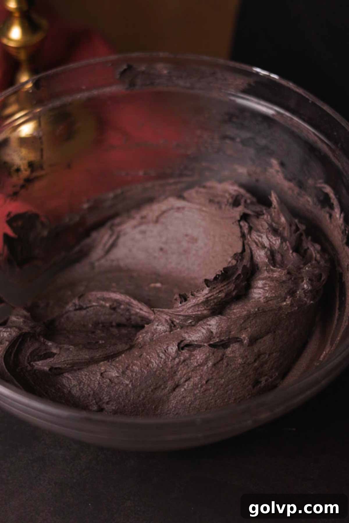 finished black cream cheese frosting in a bowl