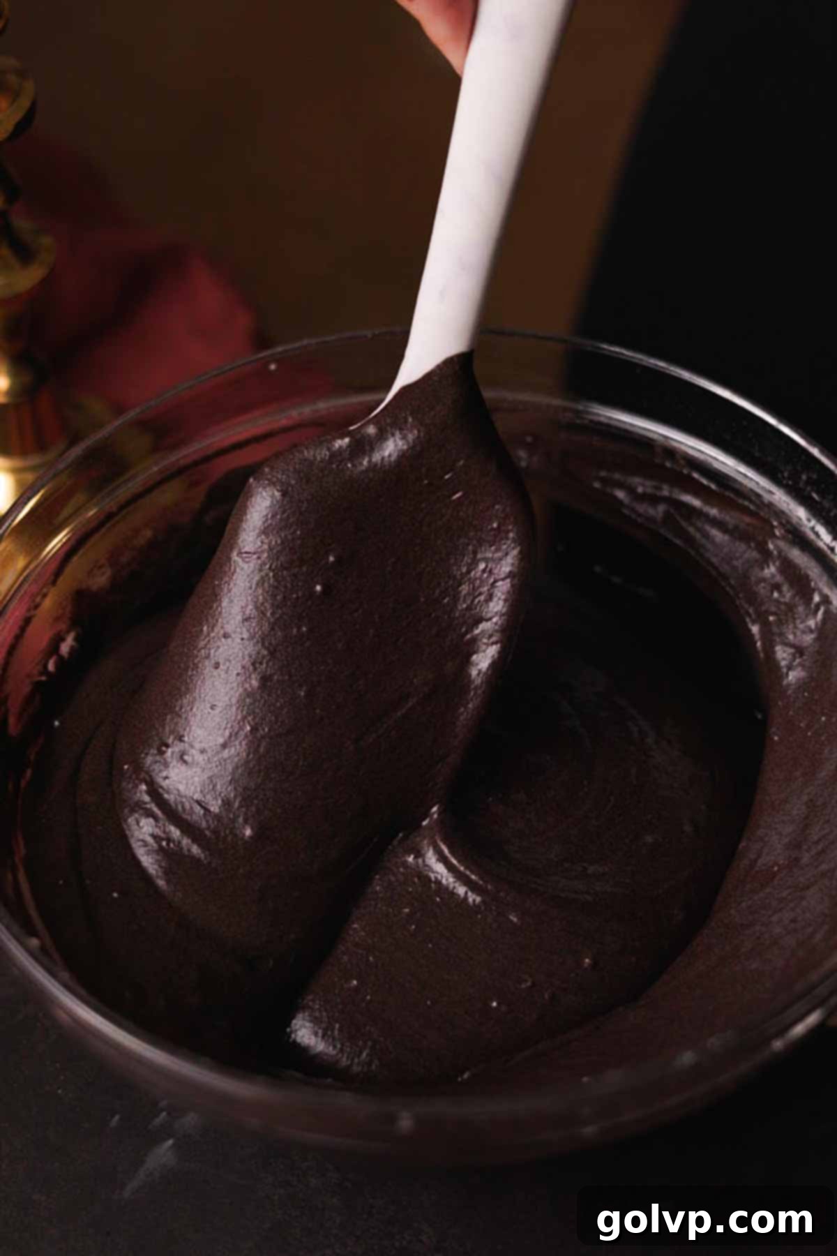 mixing black velvet cupcake batter until fully combined