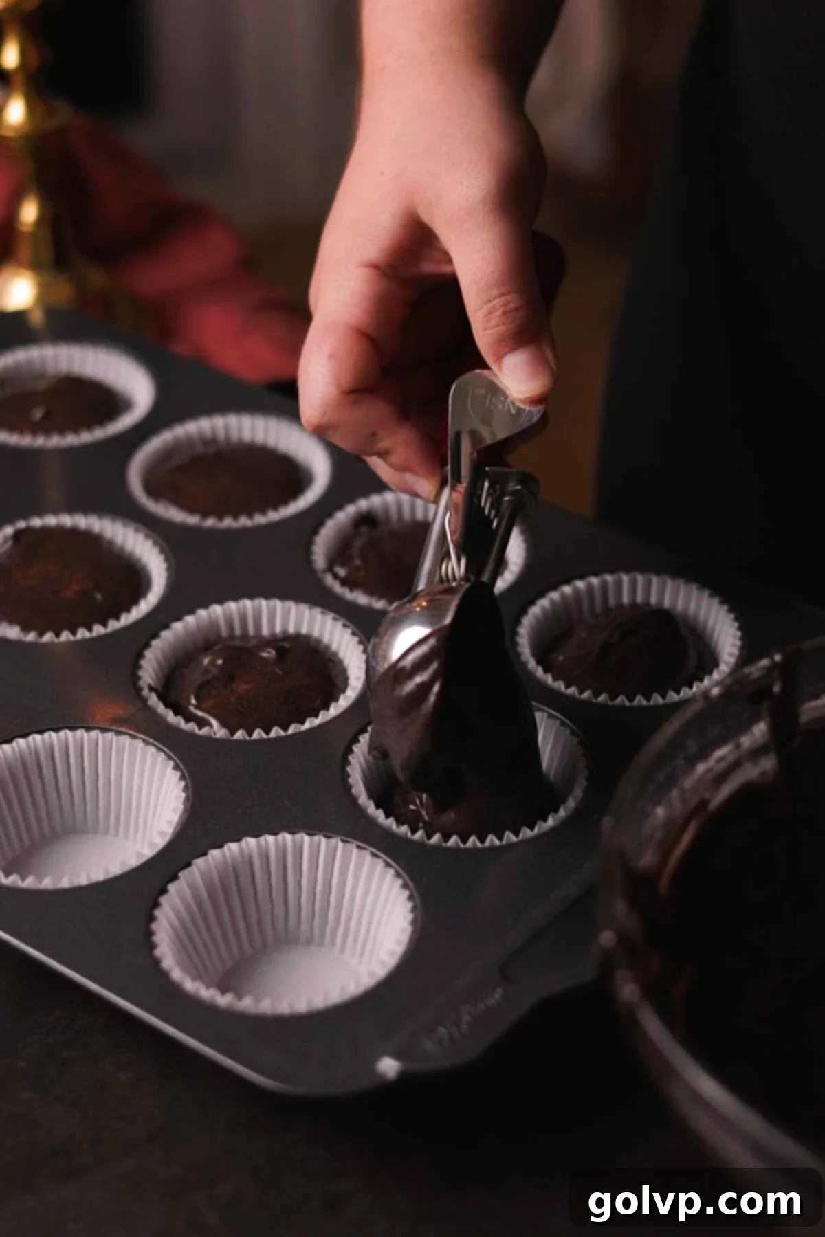 Dark Chocolate Fudge Cookies 9 scooping batter into cupcake tray