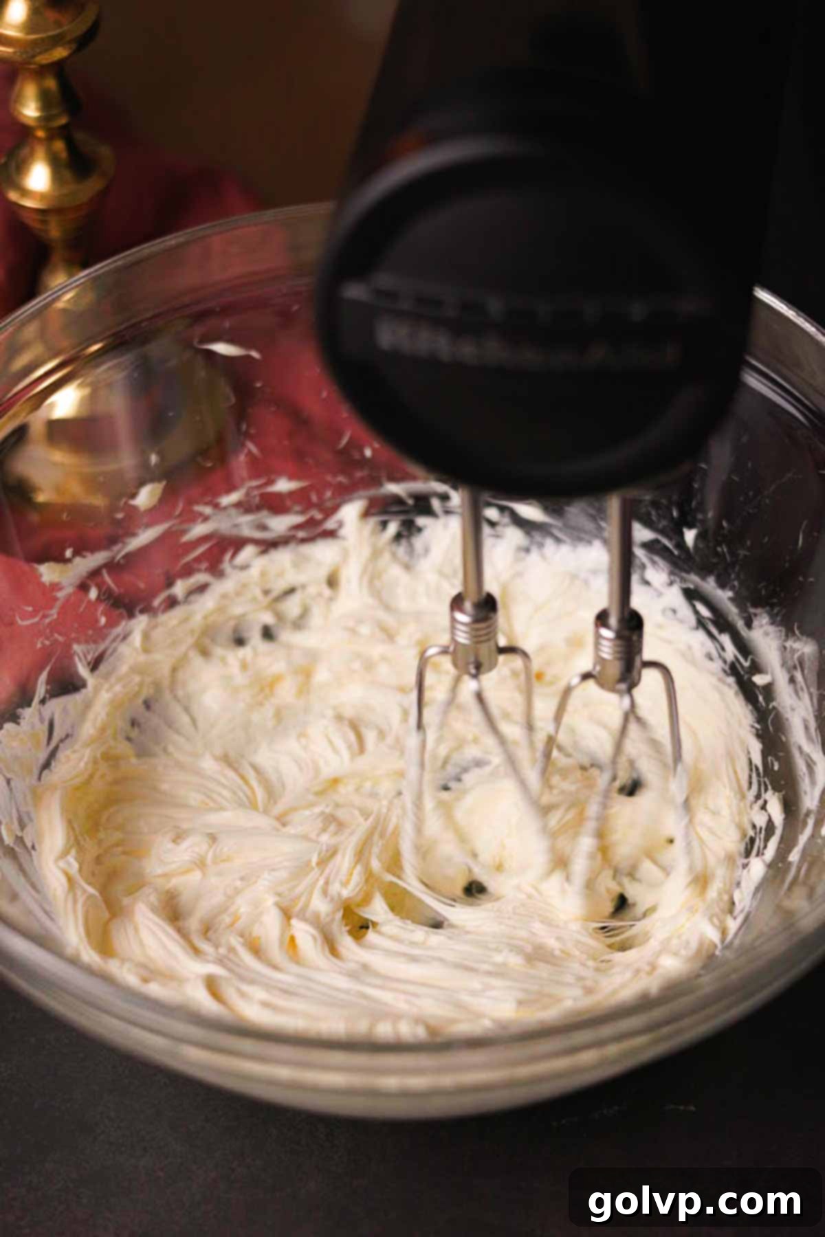 creaming together butter for black cream cheese frosting