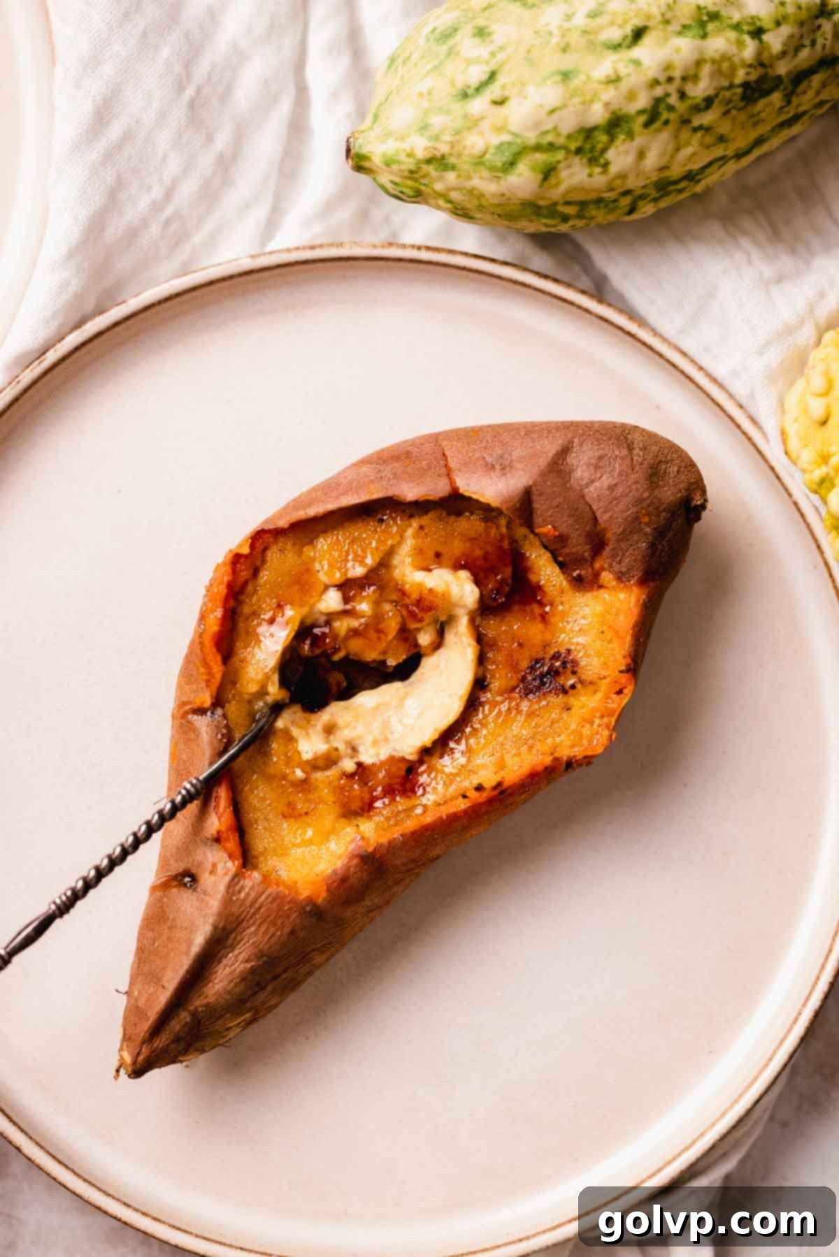 Beautifully caramelized Sweet Potato Crème Brûlée, ready to be served, showcasing its vibrant color and crunchy topping.