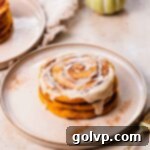 Glazed pumpkin pancakes with a distinct cinnamon swirl pattern, presented as an enticing thumbnail for breakfast or brunch.