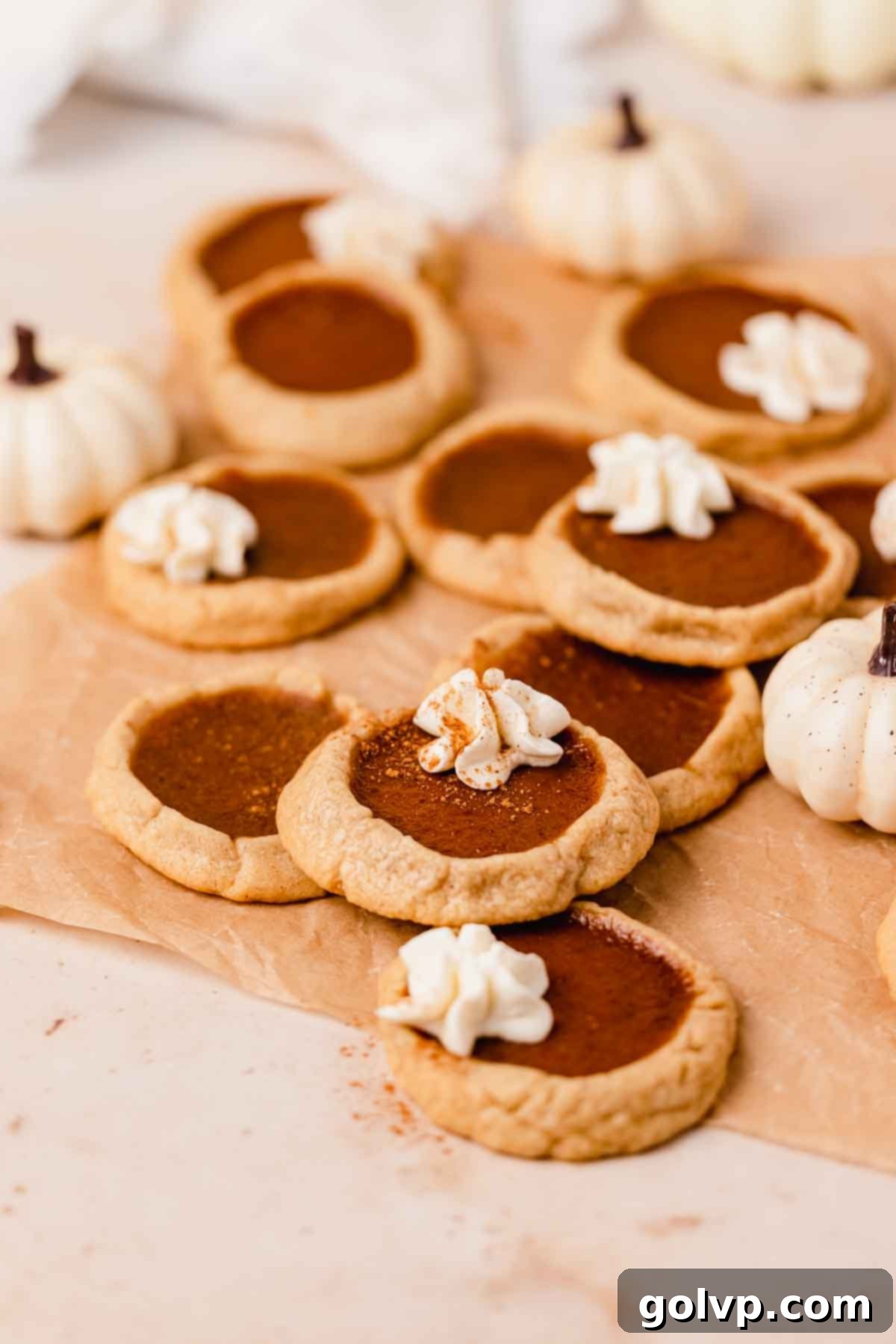 Side view of elegantly stacked pumpkin pie cookies, highlighting their distinct buttery crust and creamy pumpkin filling layers.