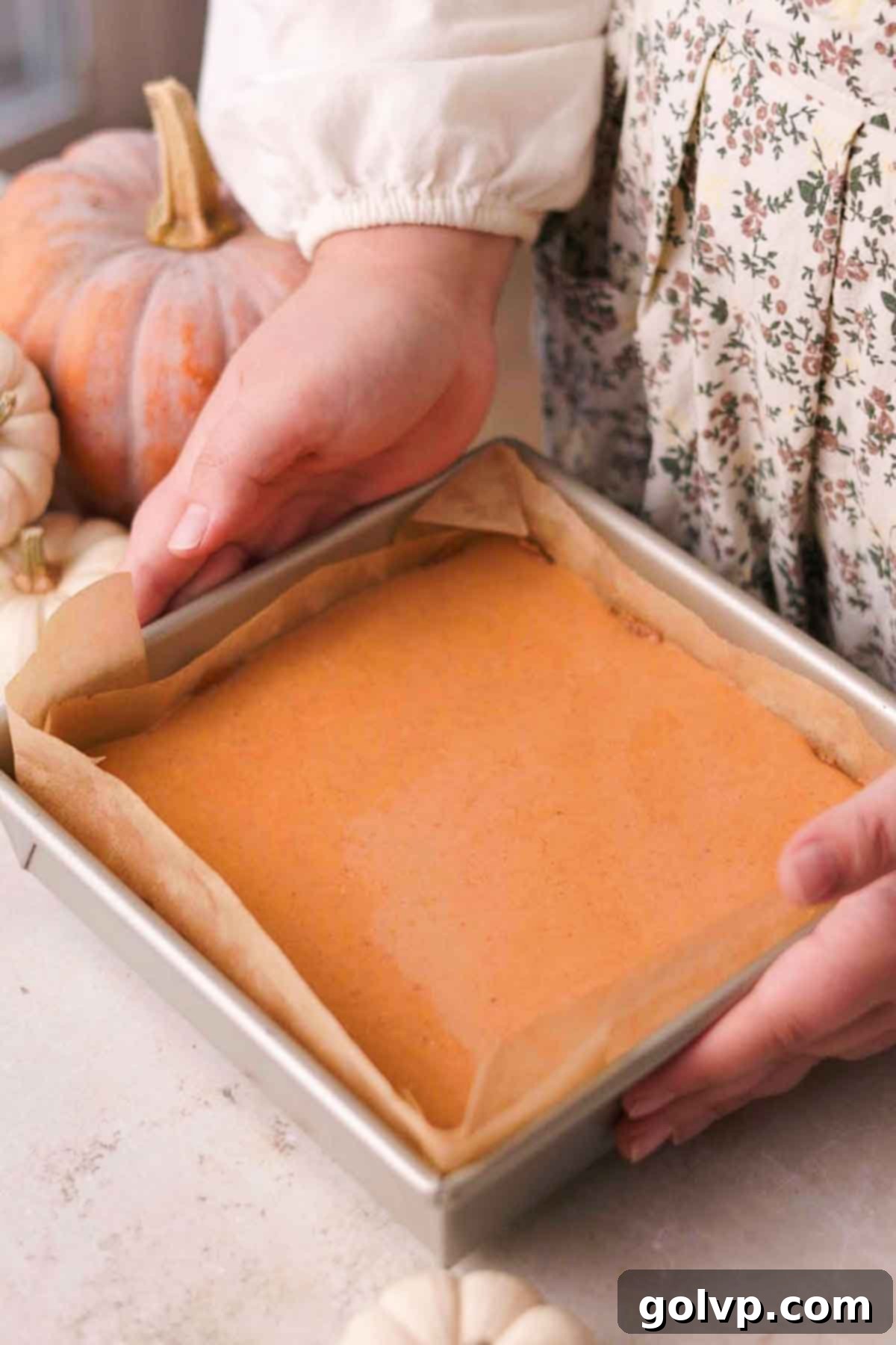 pumpkin pie bars before baking with filling poured over crust