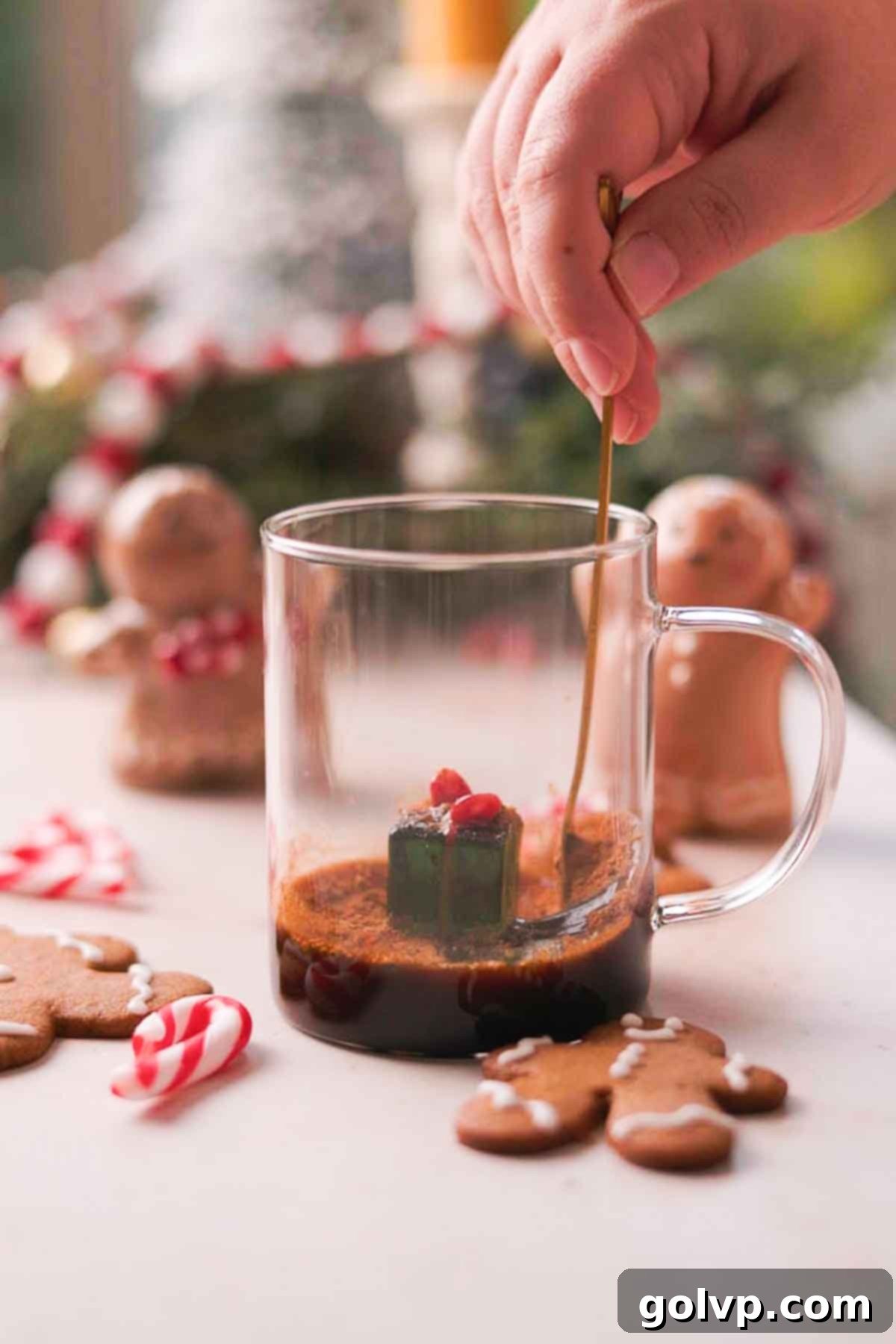 Mixing espresso, brown sugar, molasses, and spices in a mug for gingerbread latte