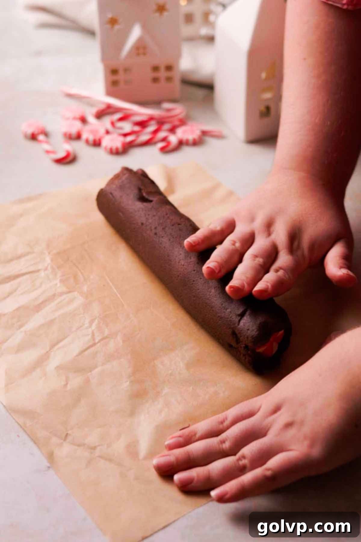 rolling out combined dough into a complete log