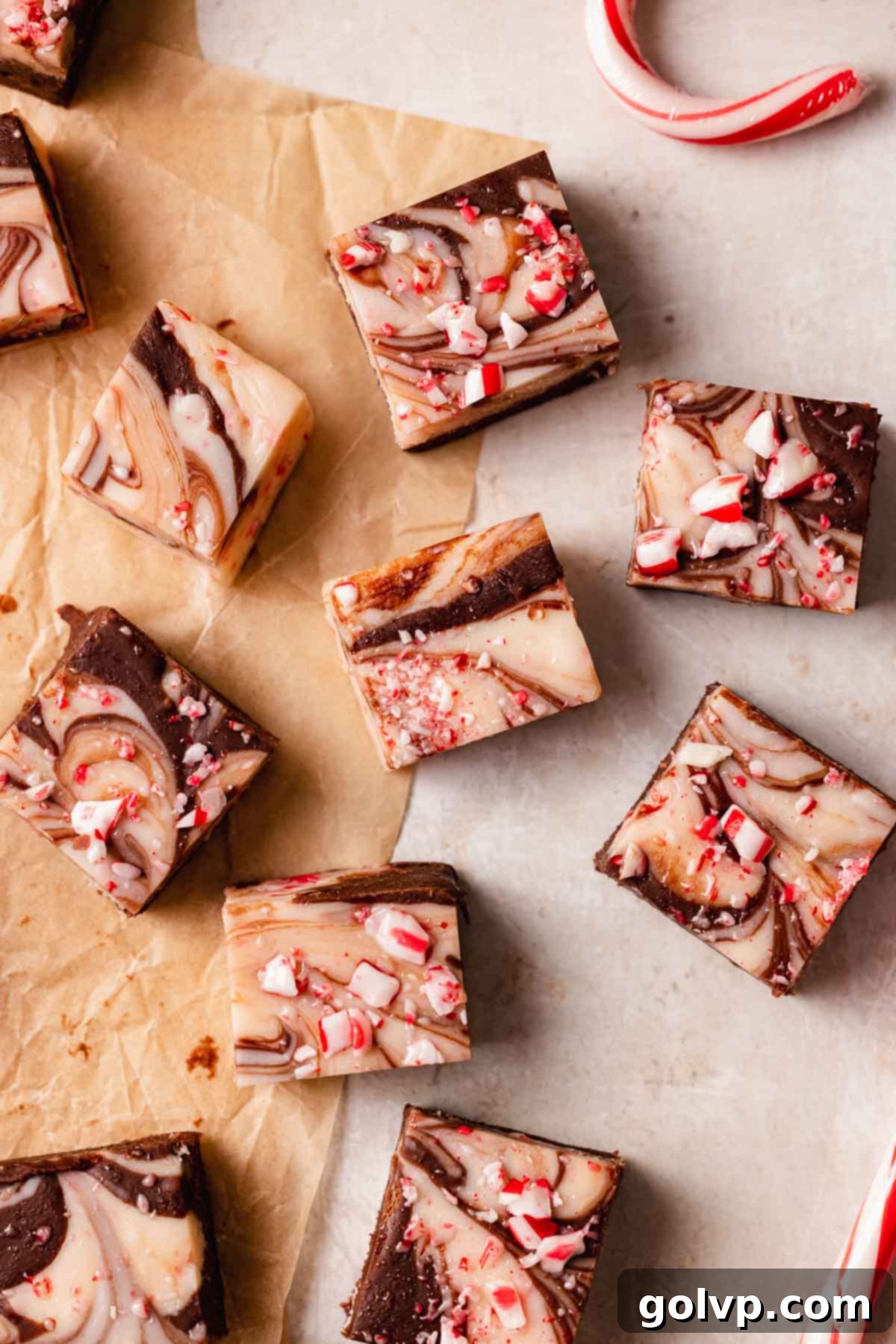 peppermint fudge squares arranged neatly on parchment paper