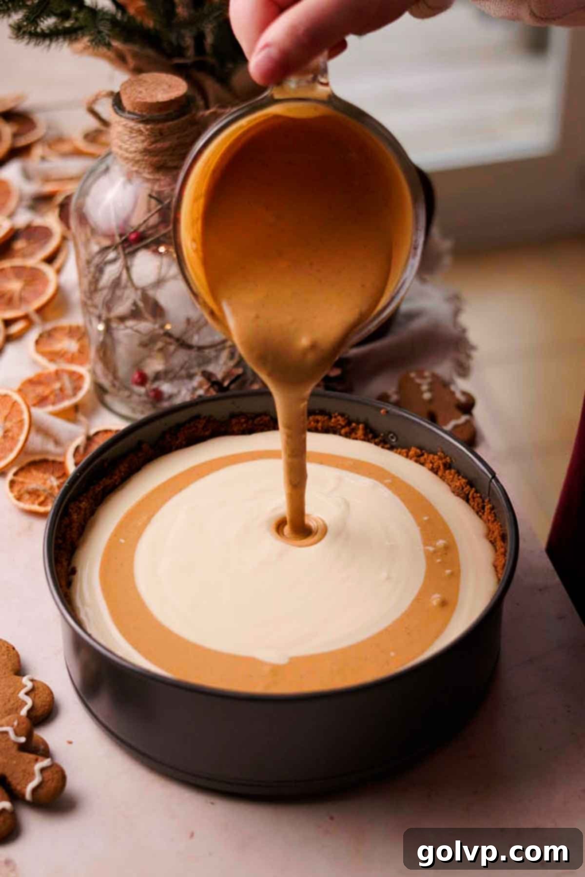 swirling the gingerbread cheesecake batter