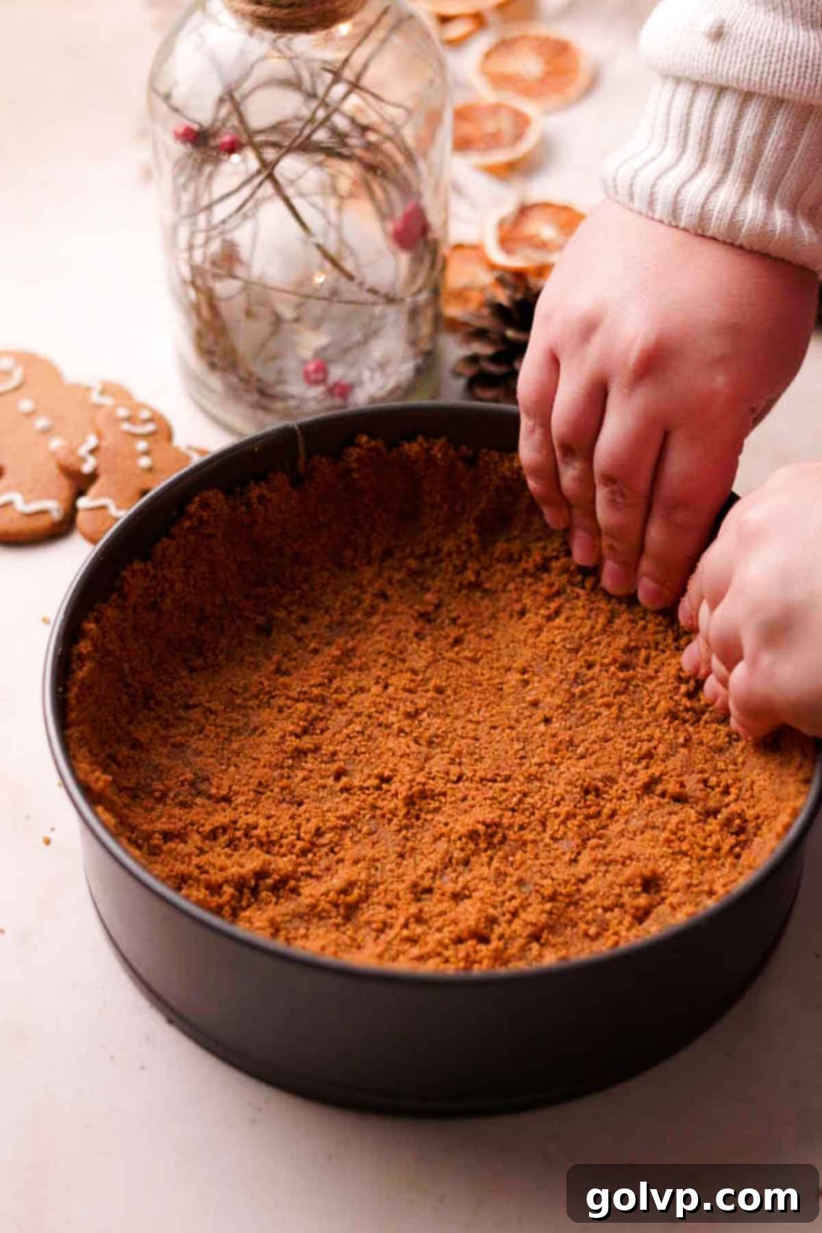 pressing down the crust in the pan