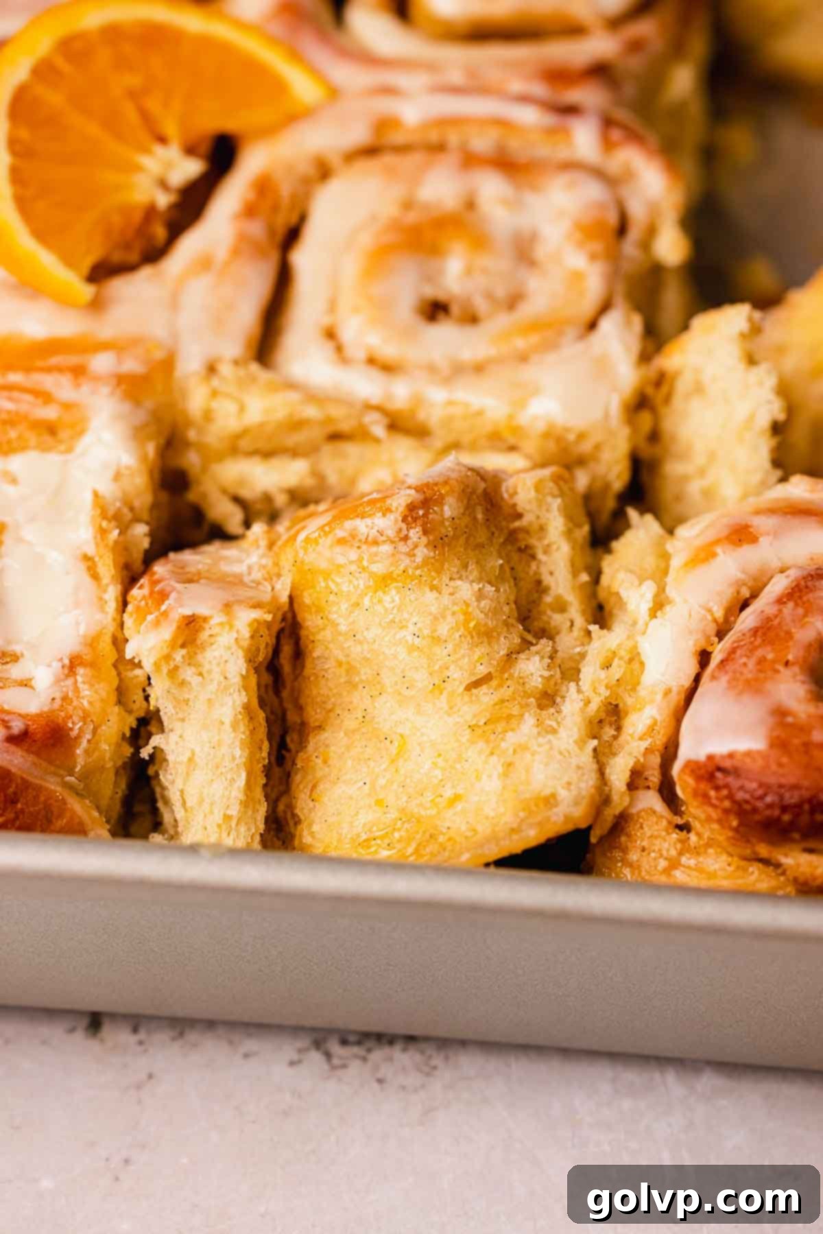 pulled apart orange cinnamon rolls