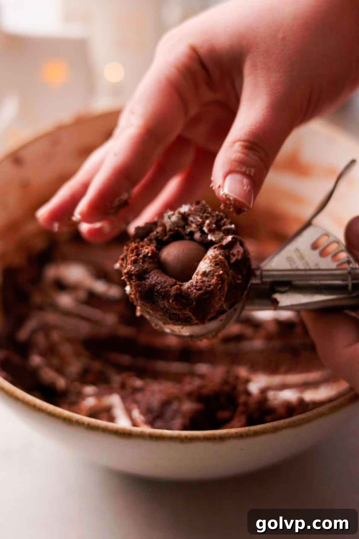 forming hot chocolate cookies with truffle inside