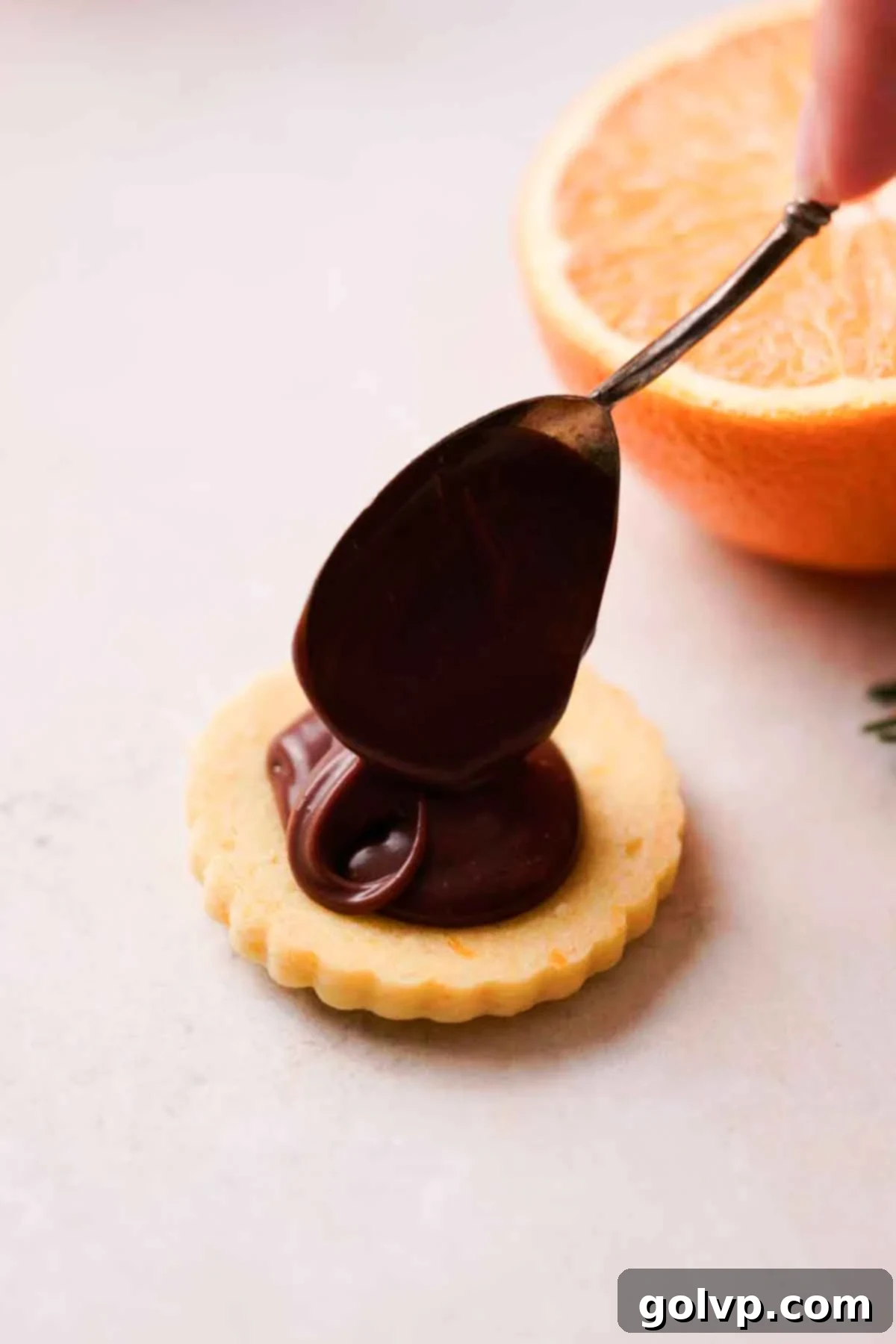 filling orange shortbread cookies with chocolate ganache
