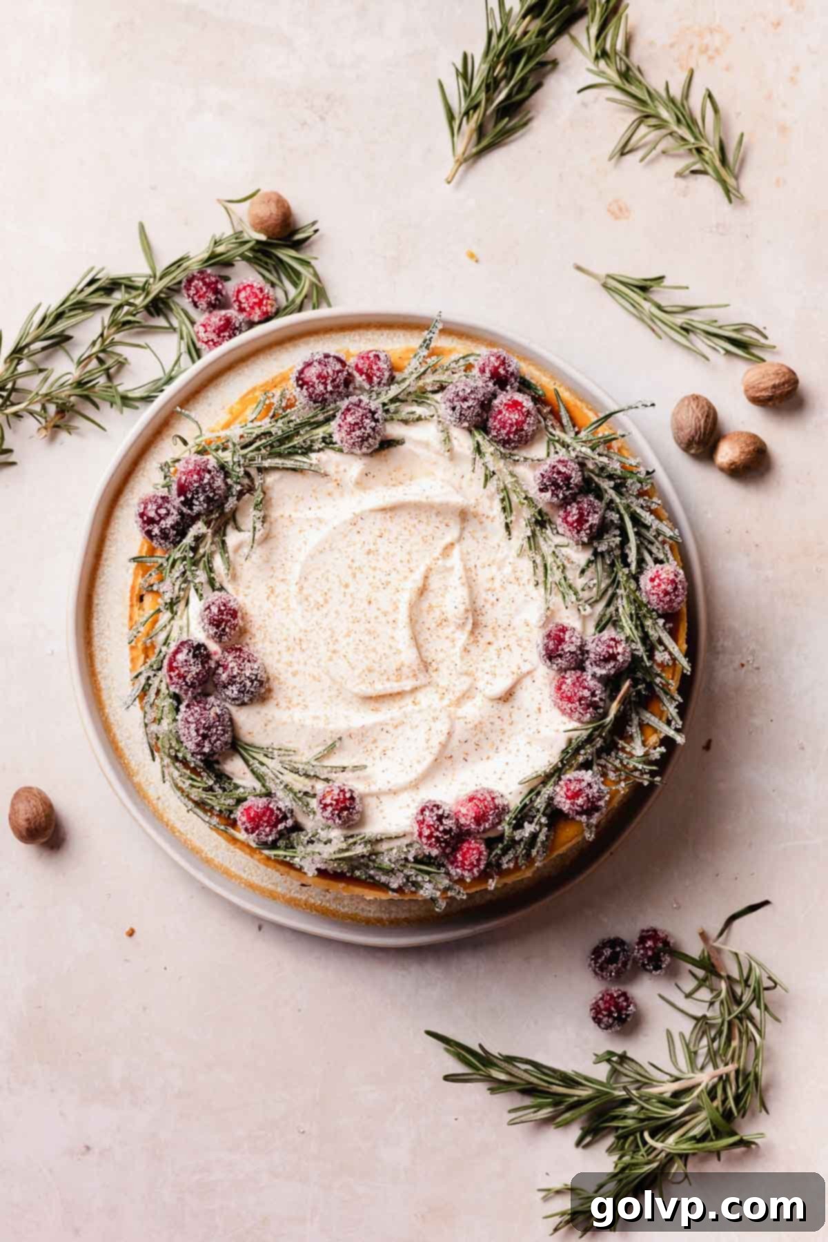 Decadent Holiday Eggnog Cheesecake 3 eggnog cheesecake with wreath decoration